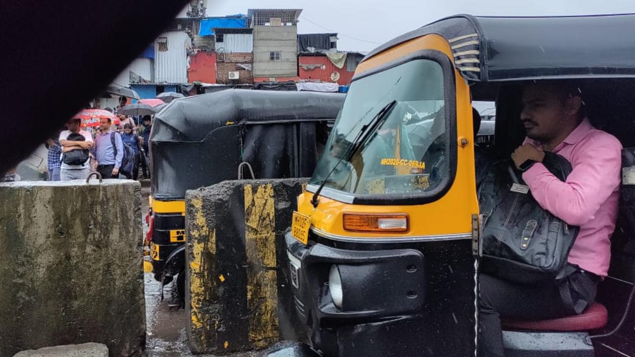People not only have to dodge potholes and flooding but also run along the stretch to be able to get one auto-rickshaw travelling towards their offices. As they dodge traffic police, people are busy running across to get the last fourth seat.