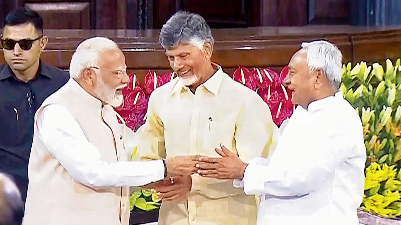 PM Modi with N Chandrababu Naidu and Nitish Kumar. File pic/PTI