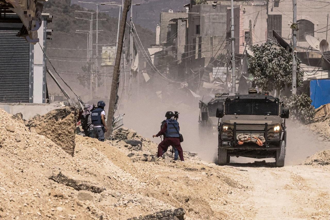 An apparent Israeli airstrike on a school-turned-shelter in southern Gaza killed at least 25 Palestinians on Tuesday, as heavy bombardment in the north forced the closure of medical facilities in Gaza City and sent thousands fleeing in search of increasingly-elusive refuge