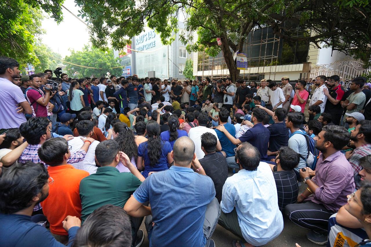 The owner and the coordinator of a coaching centre where three civil services aspirants died due to rain-induced flooding in the basement were arrested on Sunday even as protests erupted in the area over the incident