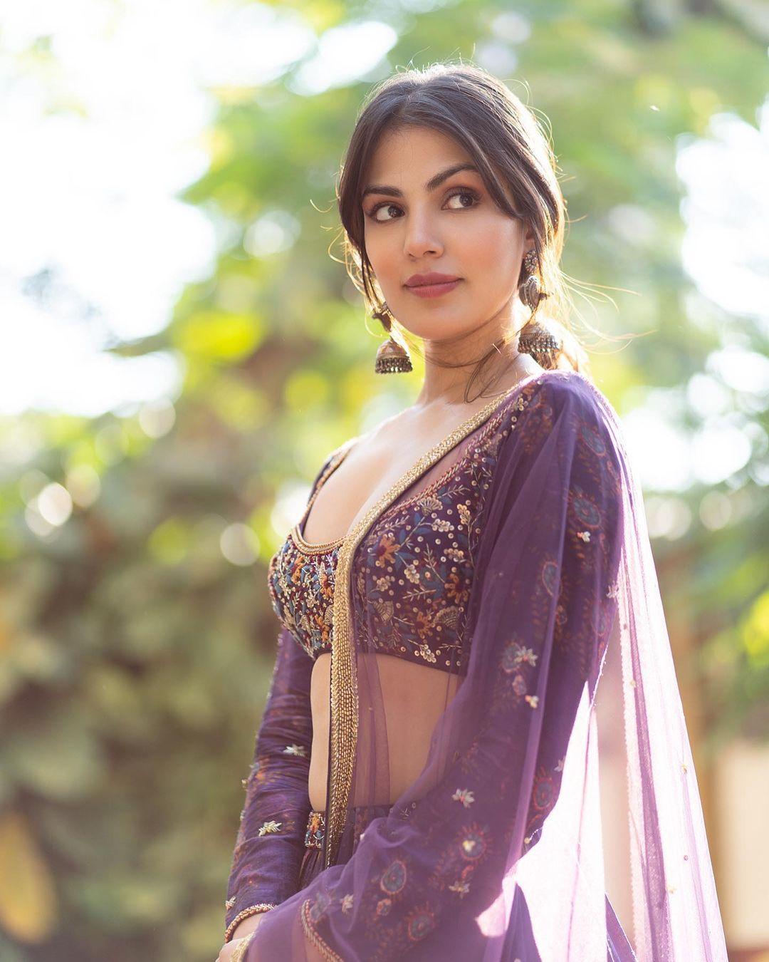 The purple lehenga has beautiful prints all over it, and the actress paired it with a heavily decorated backless blouse. We can't take our eyes off her