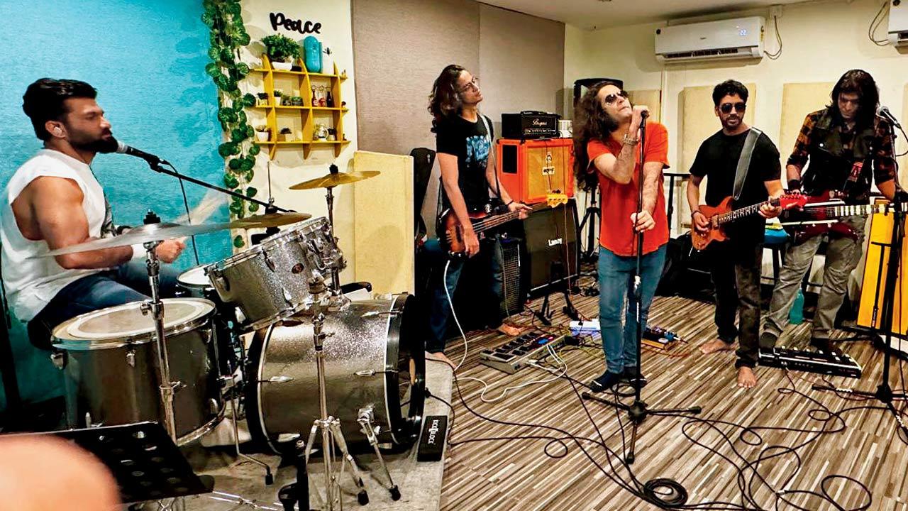 Members of the band Nightrain rehearse before the performance