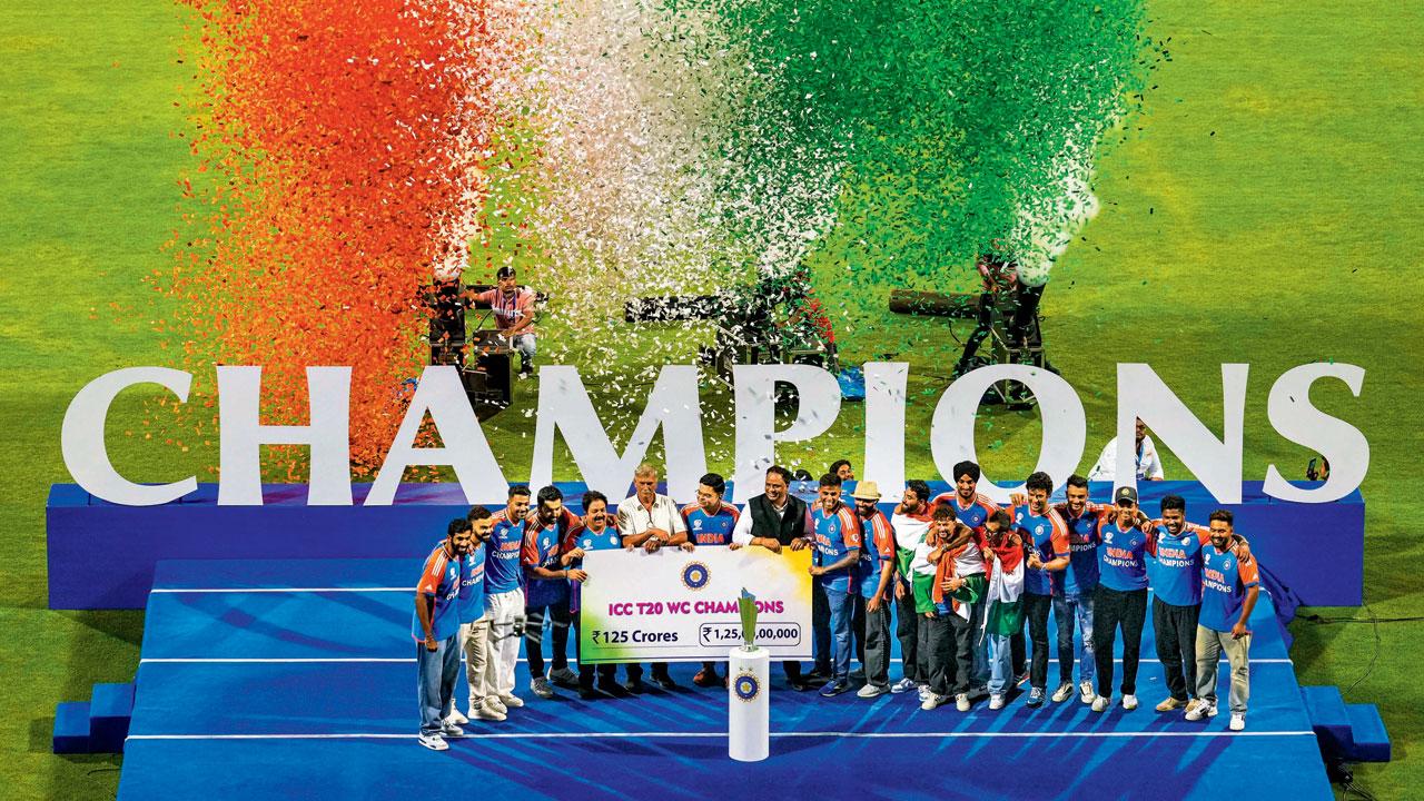 BCCI president Roger Binny (sixth from left) with India’s T20 World Cup-winning team at the Wankhede Stadium on Thursday. Pic/PTI