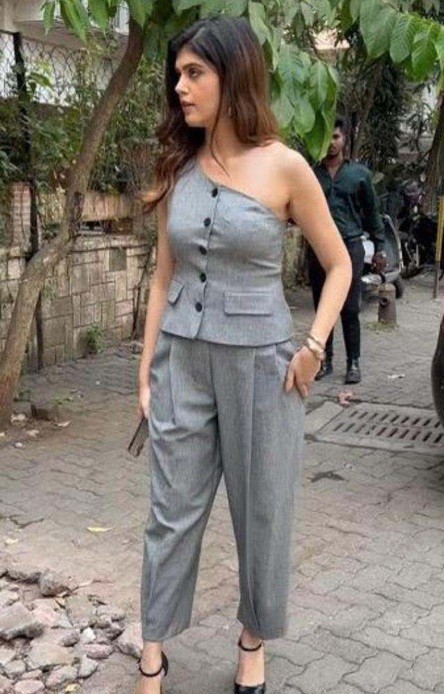 Sanjana Sanghi nails the business casual look with a grey one-shoulder top paired with matching trousers