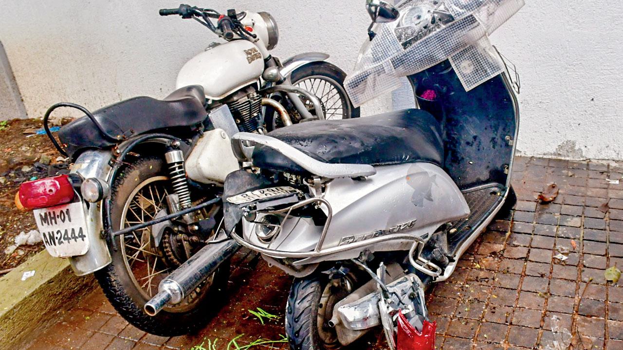 A damaged two-wheeler (right) that the victim was on. Pic/PTI