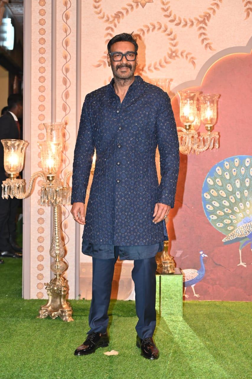 Ajay Devgn posed for the paparazzi in a blue structured kurta