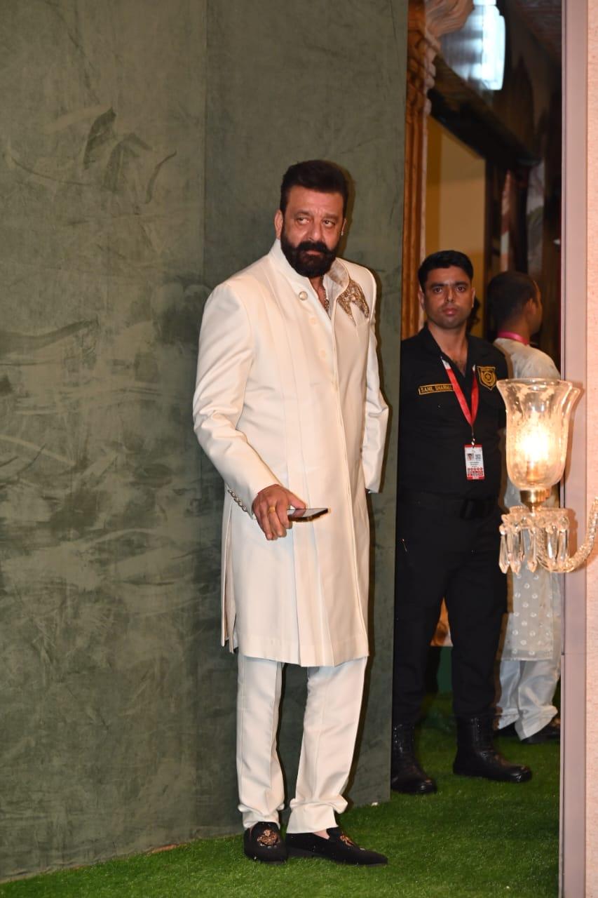 Sanjay Dutt very briefly stopped for the paparazzi before heading into the venue