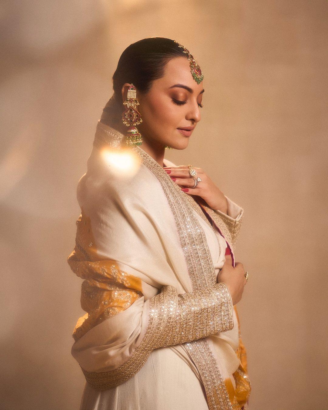 The actress tied her hair back and accessorized her look with big earrings and a maang tikka