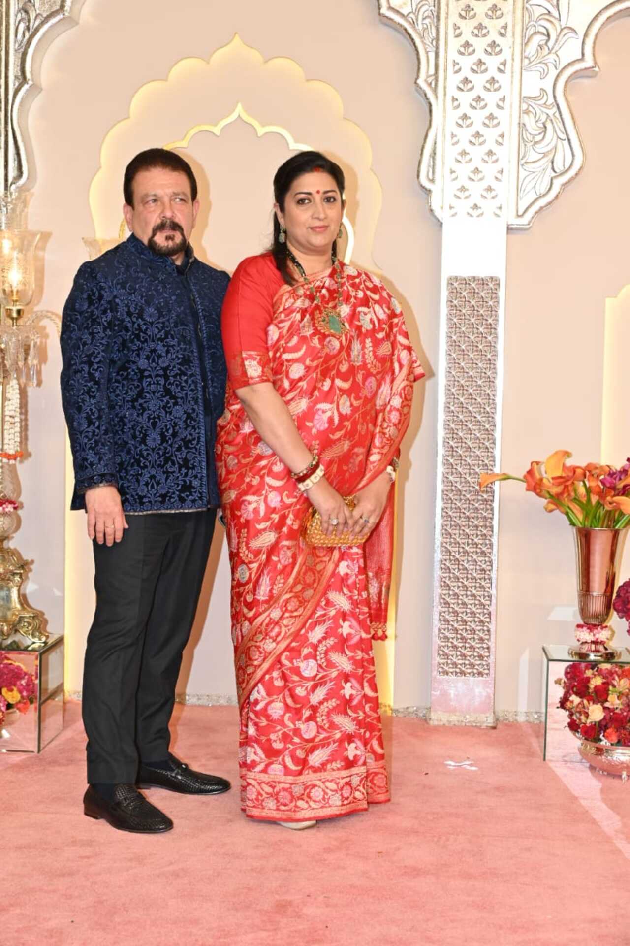 Smriti Irani also attended the wedding ceremony of Radhika and Anant. She opted for a printed red saree, which she paired with a contrasting green neckpiece