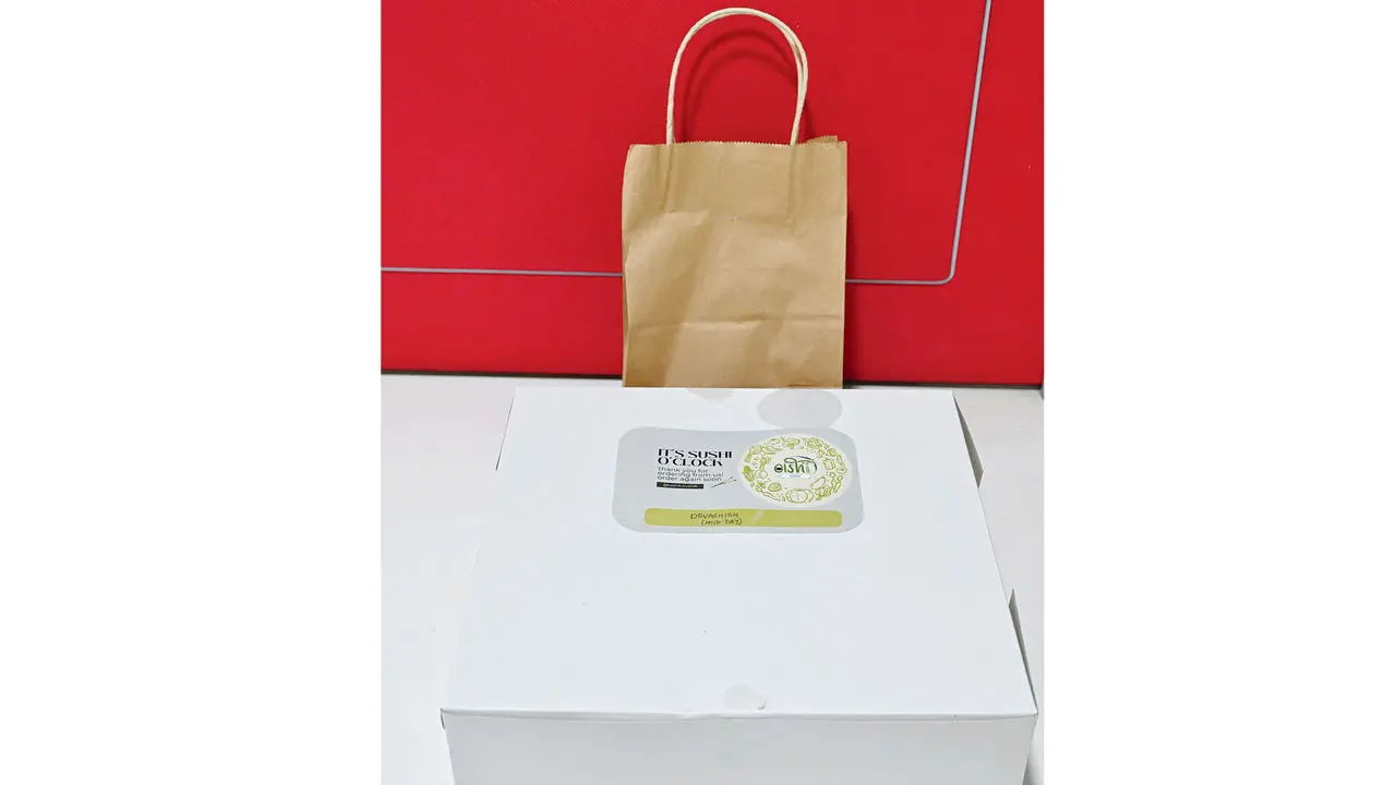 The sushi cake comes packed in a paper box, with the condiments packed separately