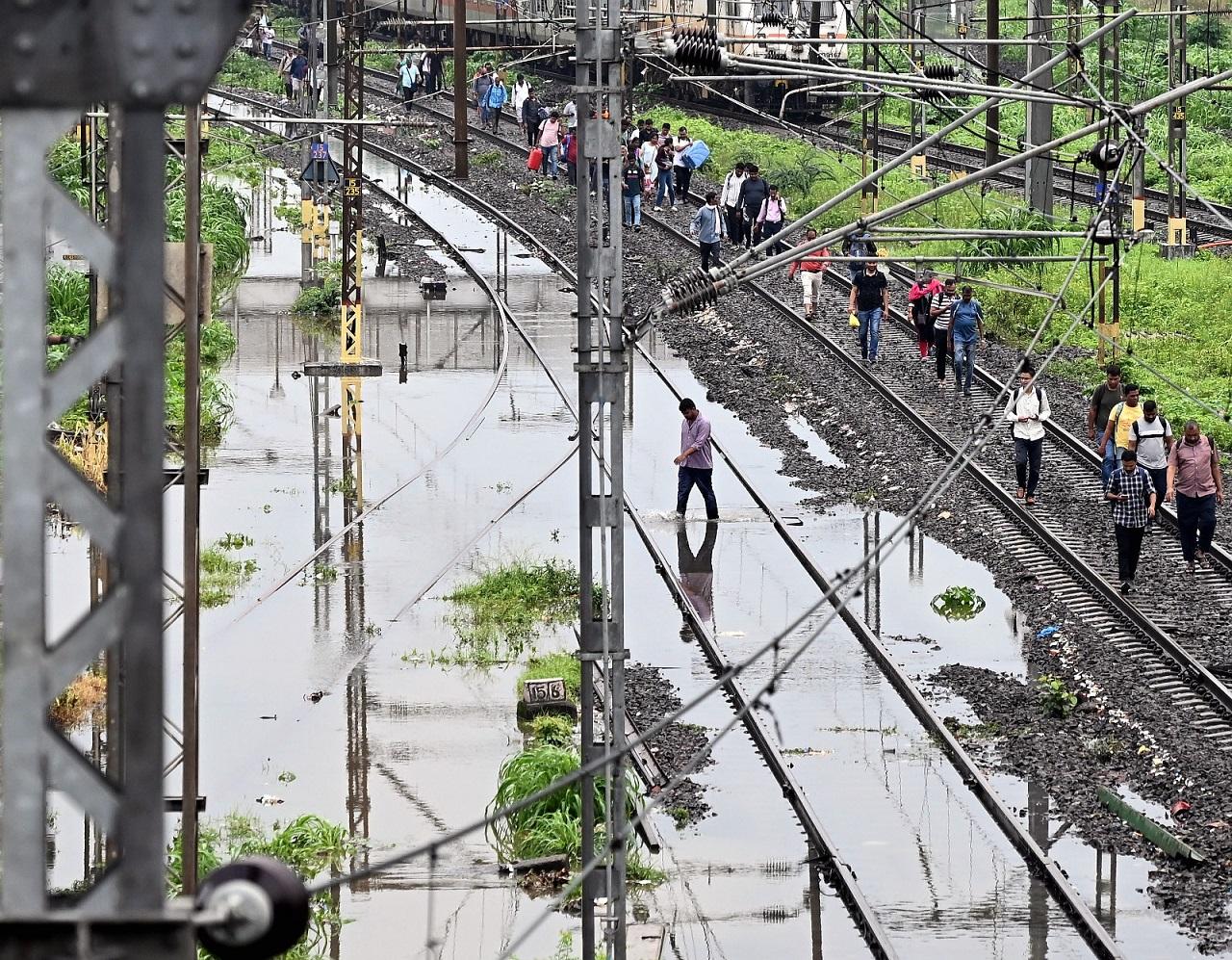 The Western Railway said suburban trains were running up to 10 minutes late because water was above the track level between Matunga Road and Dadar due to heavy showers
