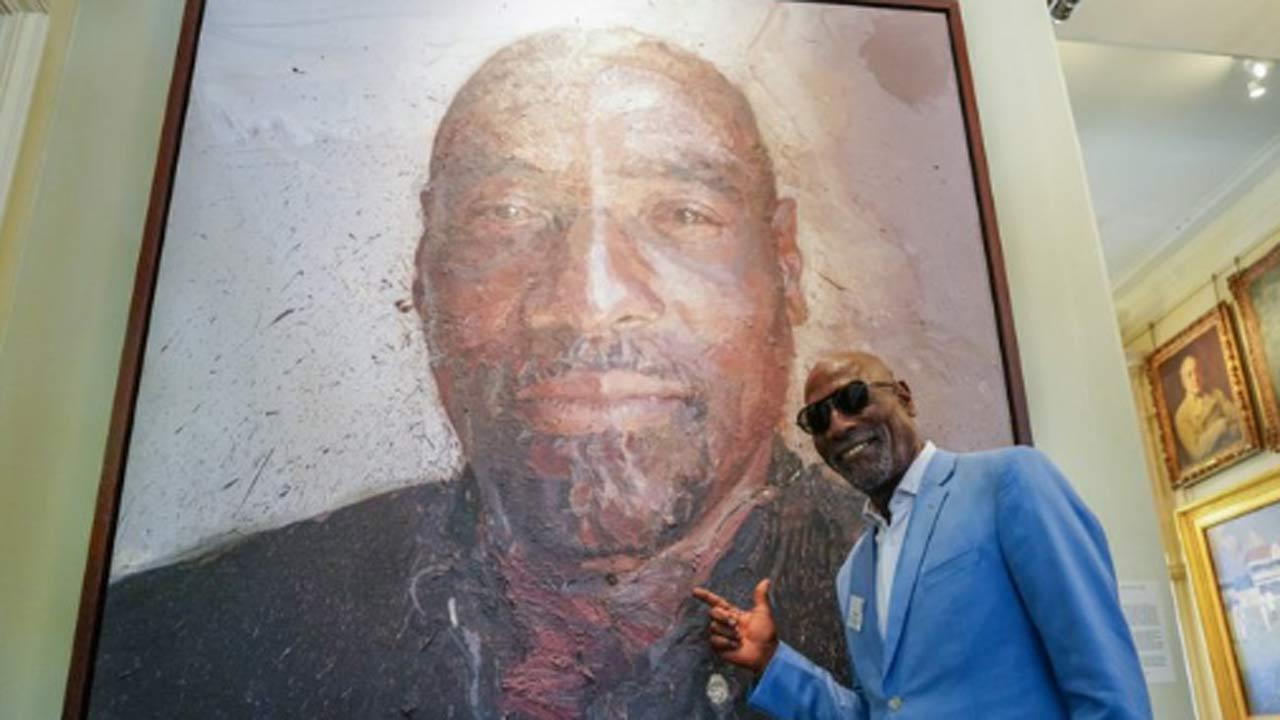 Vivian Richards poses with his portrait at Lord's during England vs West Indies first Test
