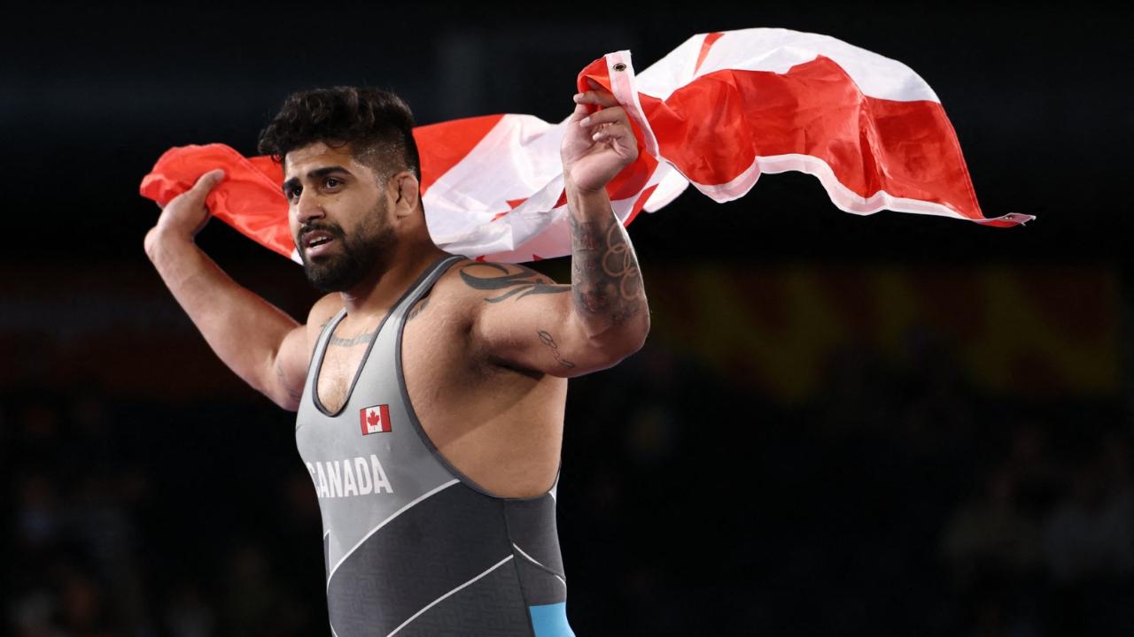 Amar DhesiAmarveer was born in Surrey, British Columbia, a small province on the western coast of Canada to Balbir Dhesi. A former Greco-Roman national champion, Amar's father belongs to village Sanghwal in district Jalandhar in Punjab. Balbir had trained at the NIS Patiala and even got a job with the Punjab Police but moved to Canada in search of greener pastures in 1979. Once there, he worked in a sawmill factory and started the Khalsa Wrestling Club for youth in Surrey in 1985. Amar would attend practice with his dad and older brother Paramveer since he was five and entered his first competition as an eight-year-old. Amar, who loves to watch London Games bronze-medallist Yogeshwar Dutt's wrestling videos, made his Olympic debut at Tokyo 2020 where he finished 13th in the men's 125kg freestyle event. He won his first senior gold medal a year later at the Pan American Championships and then captured 125kg gold at the Commonwealth Games in Birmingham. The 28-year-old will compete in the men's 125kg freestyle event