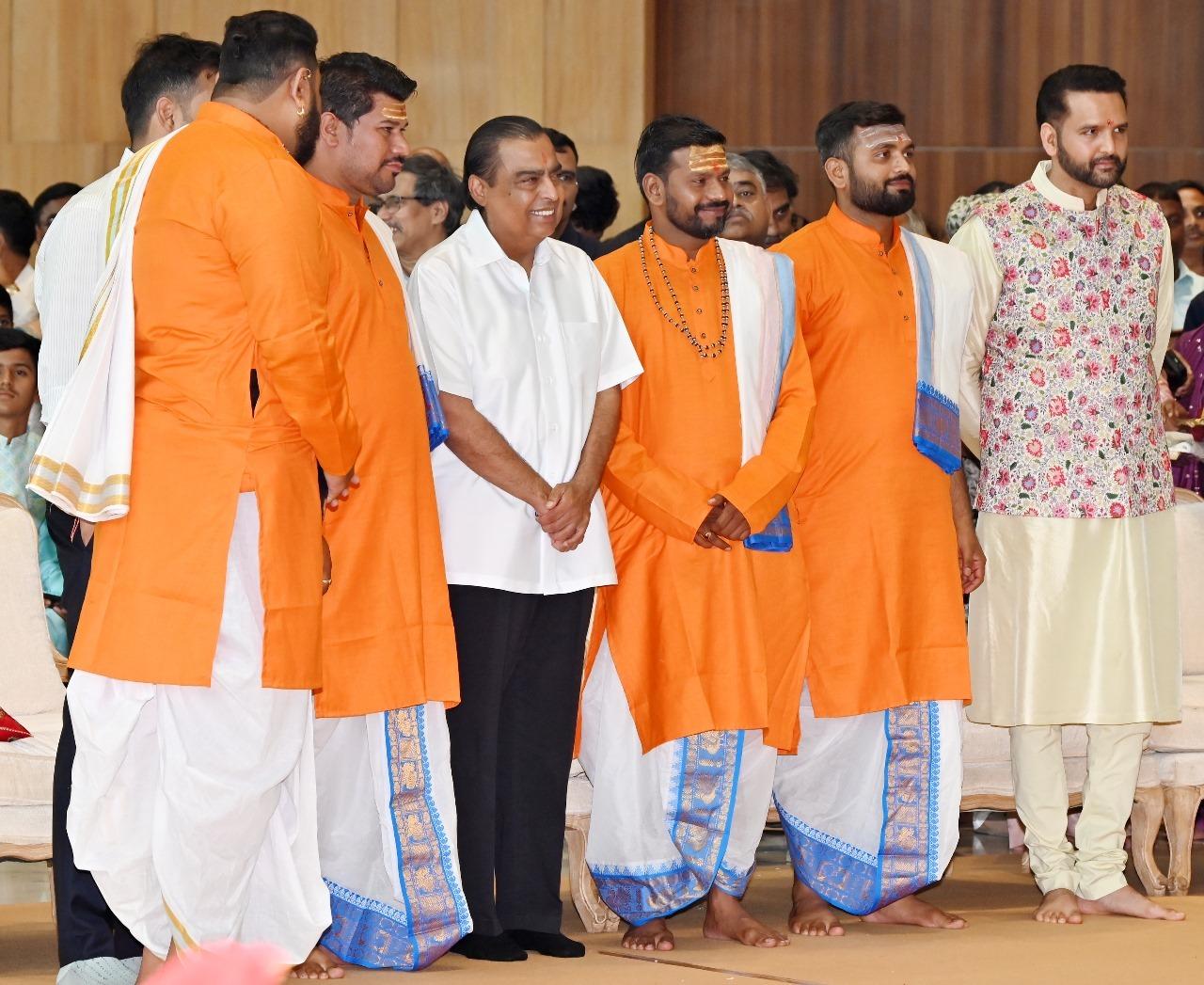 Mukesh Ambani with the priests who conducted the rituals of the wedding 