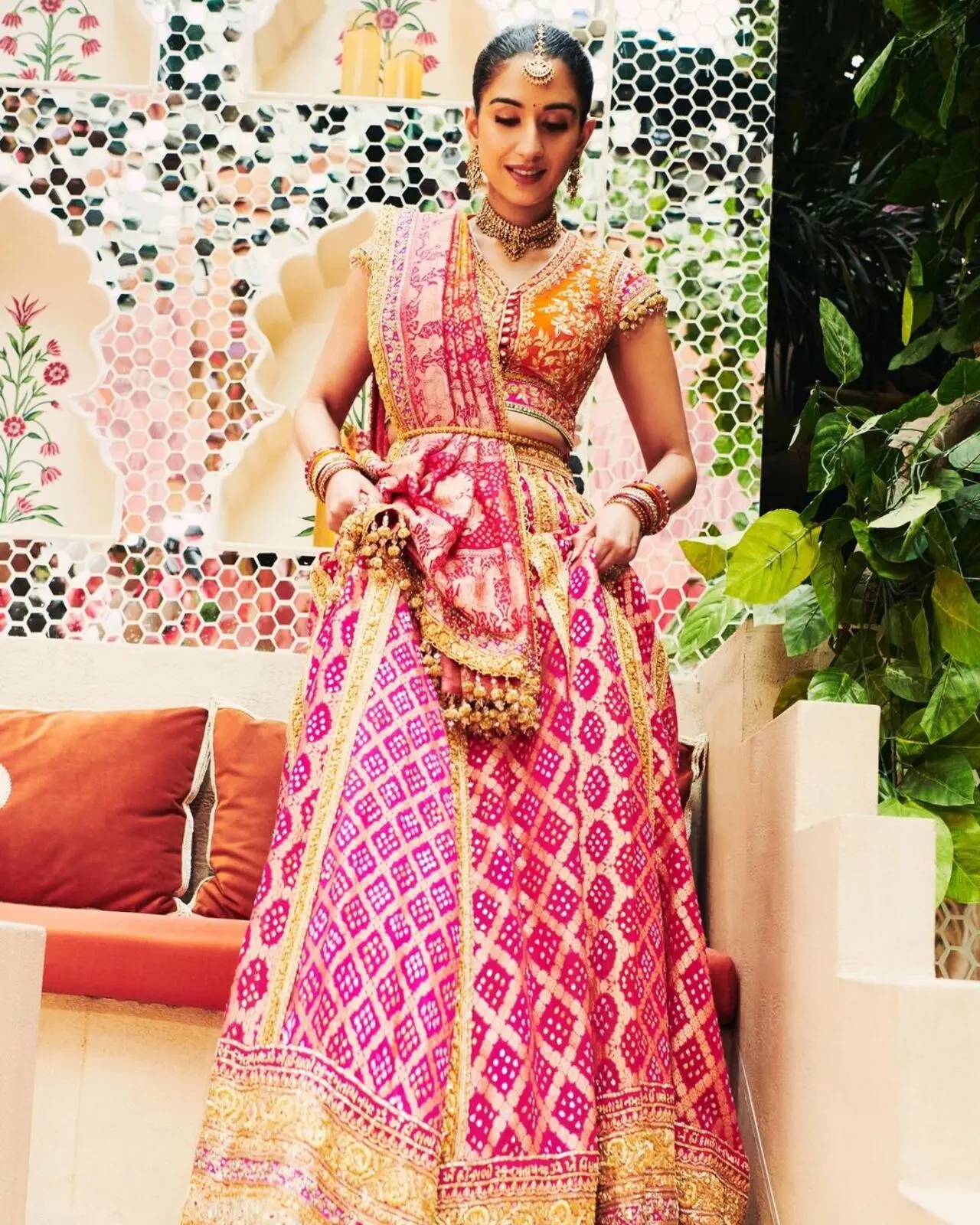 The borders of the ensemble had Durga Maa shloka embroidered and 35 meters of bandhej was used to make the ghagra. The blouse was inspired by a vintage Koti. 
