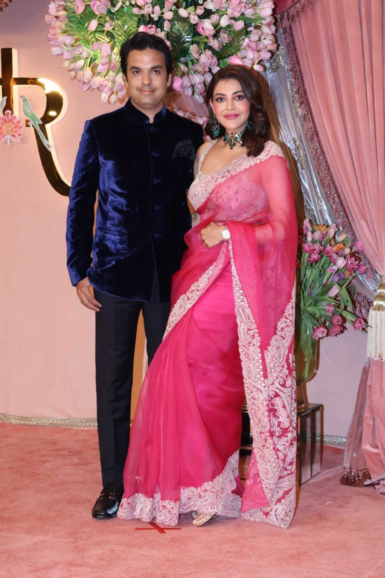 Kajal Aggarwal kept it simple yet stylish in a bright pink saree alongside husband Gautam Kitchlu.