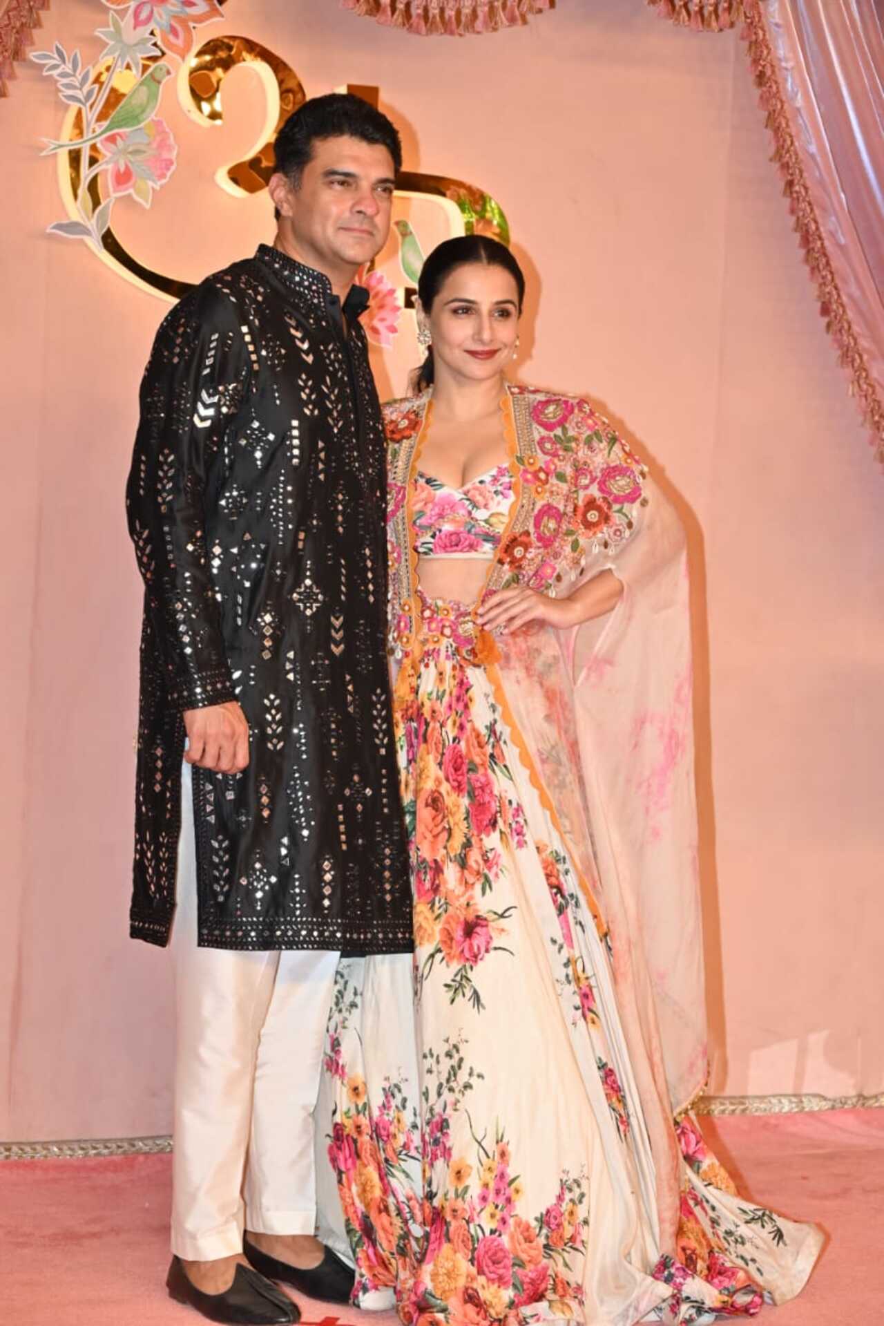 Vidya Balan exuded charm in her floral ensemble alongside her husband Siddharth Roy Kapur. 