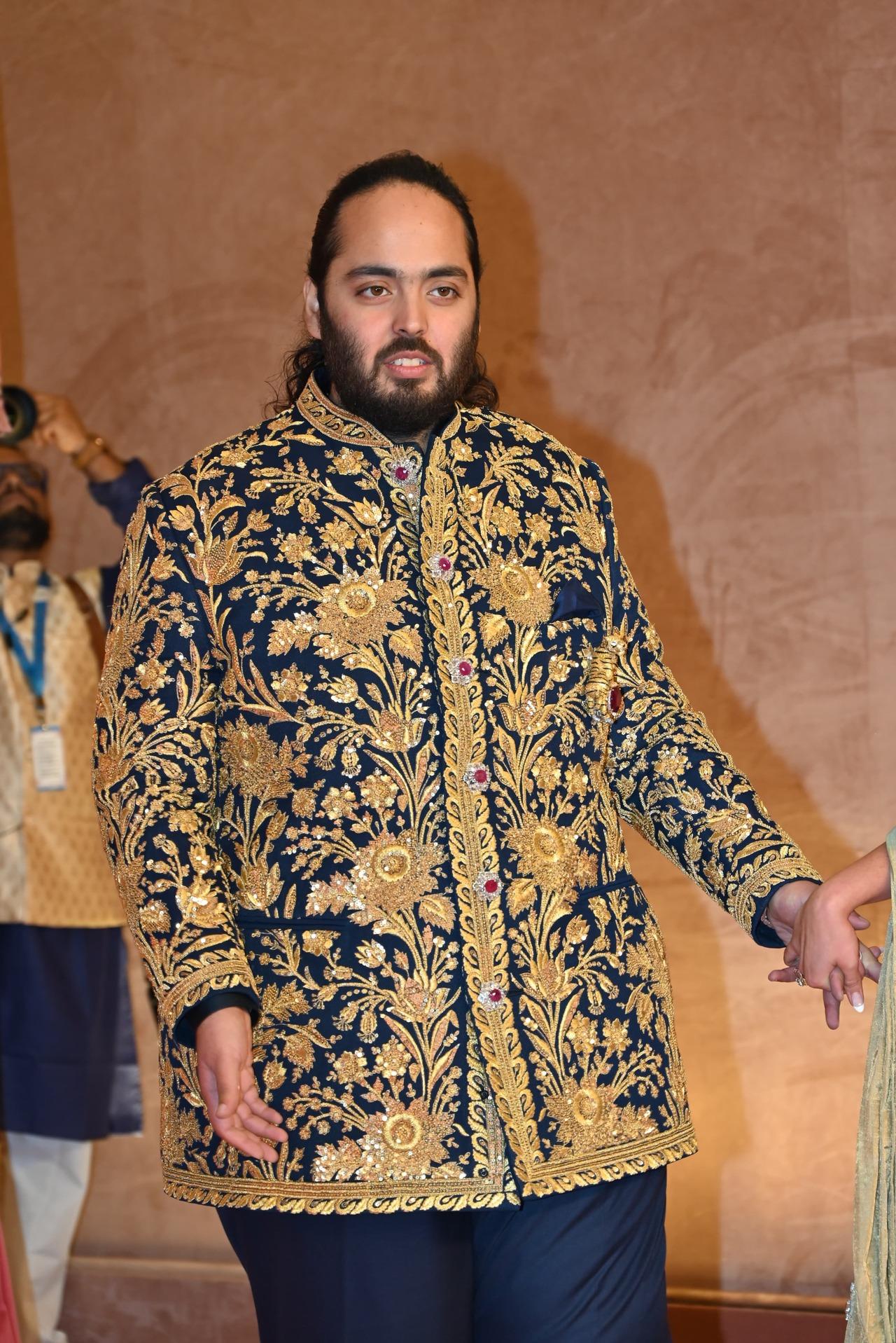 Anant wore a midnight blue bandhgala, divinely embroidered like a Persian Garden in real gold zari, kasab, and sequins.