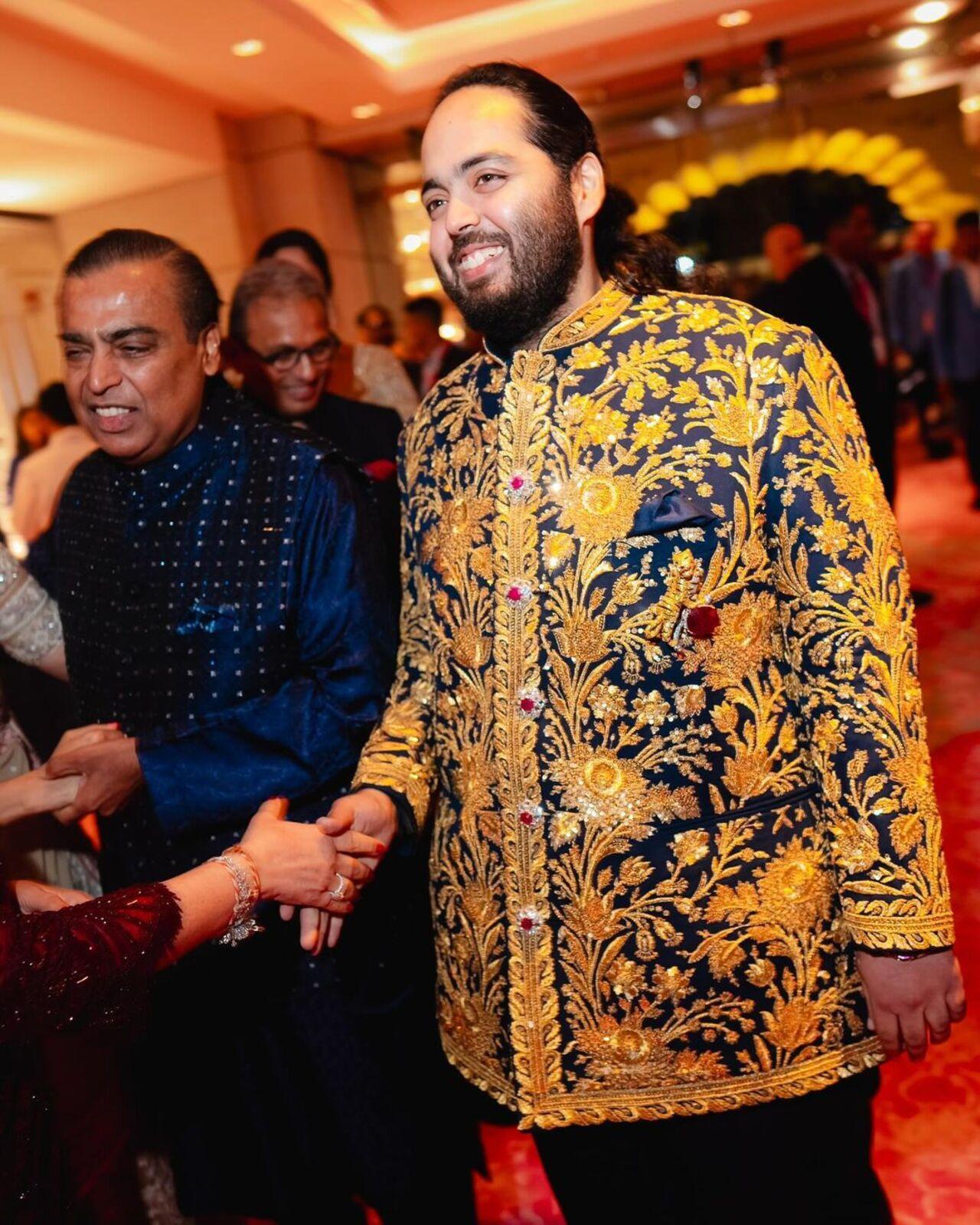 For his sangeet night, Anant wore a midnight blue Bandhgala, embroidered with real gold zari, custom-made by Abu Jani Sandeep Khosla. 