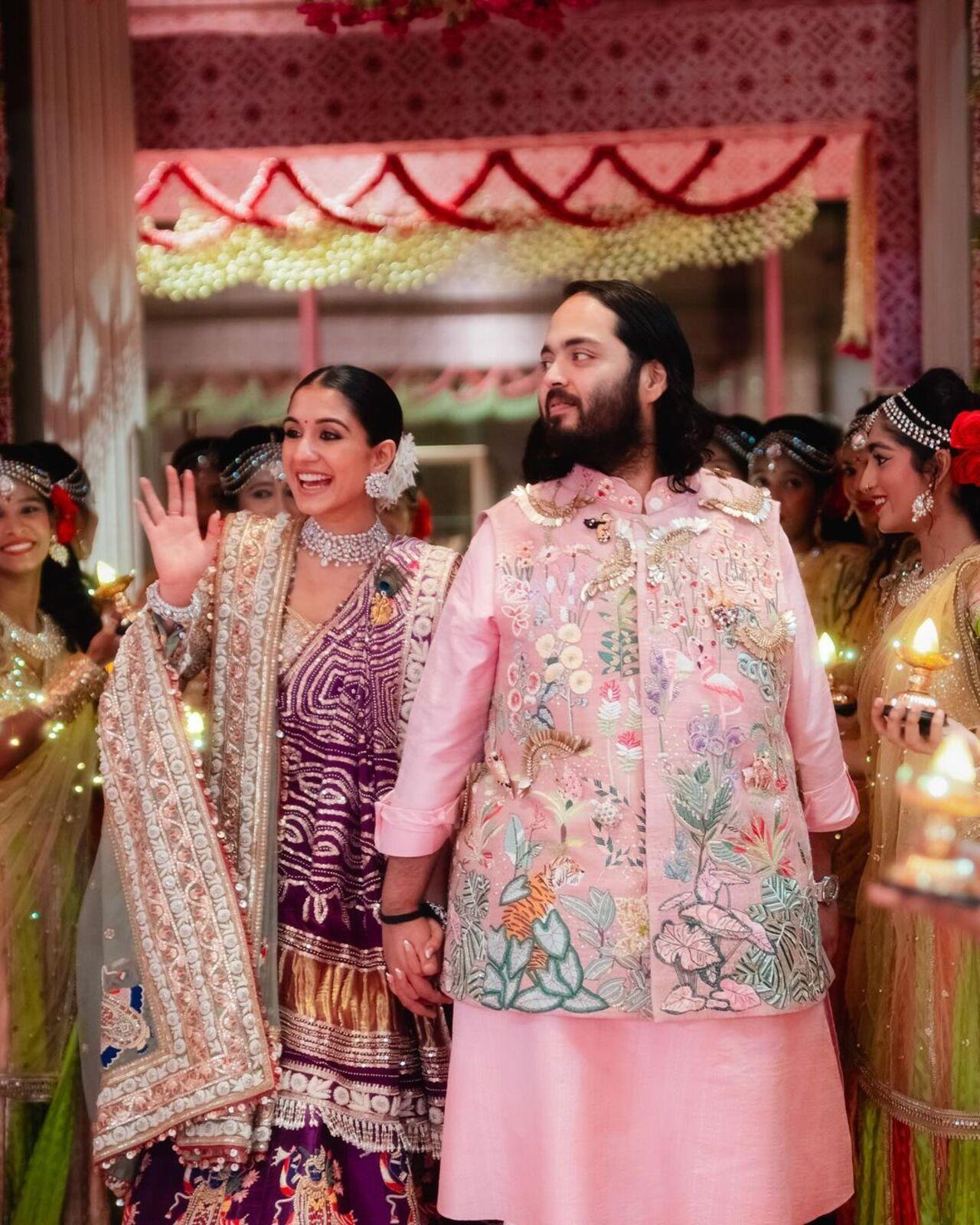 For the garba night, Anant wore a blush pink outfit with intricate embroidery and sequins by Rahul Mishra. 