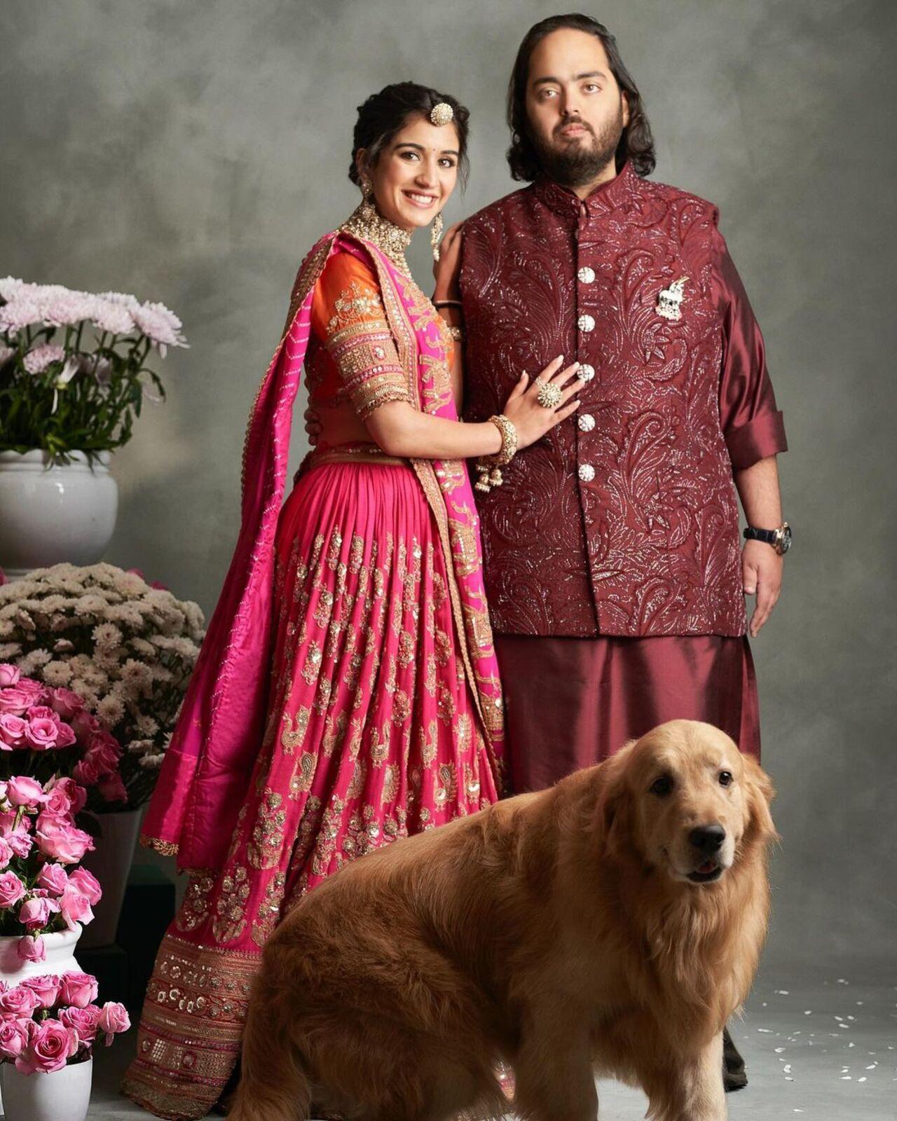 He picked the same designer for the pre-wedding celebrations but this time in a deeper shade of crimson. 