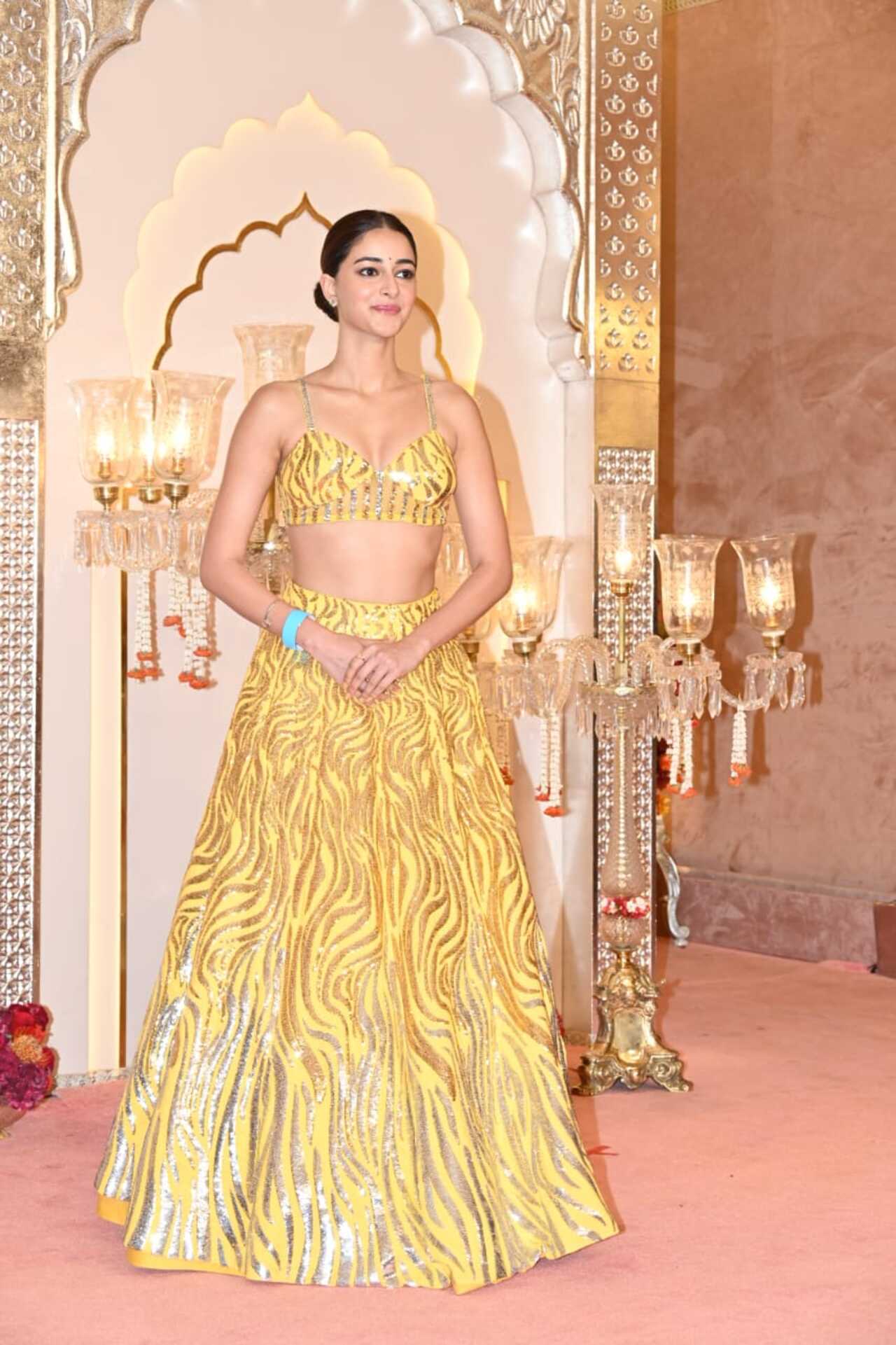 Ananya Panday sports a yellow lehenga for the festivity. She will later change her outfit post her performance