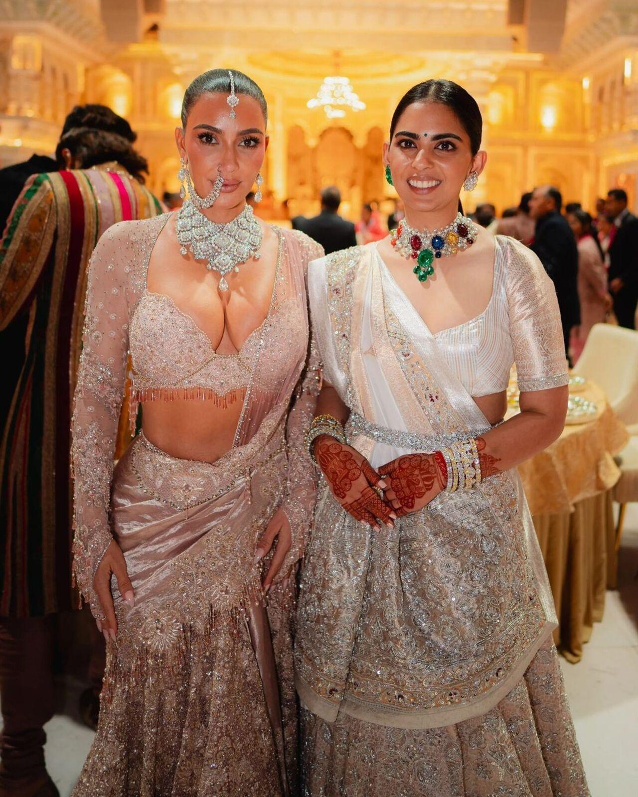 On the same day, Kim was seen in a custom Tarun Tahiliani ensemble and posed alongside Isha. 