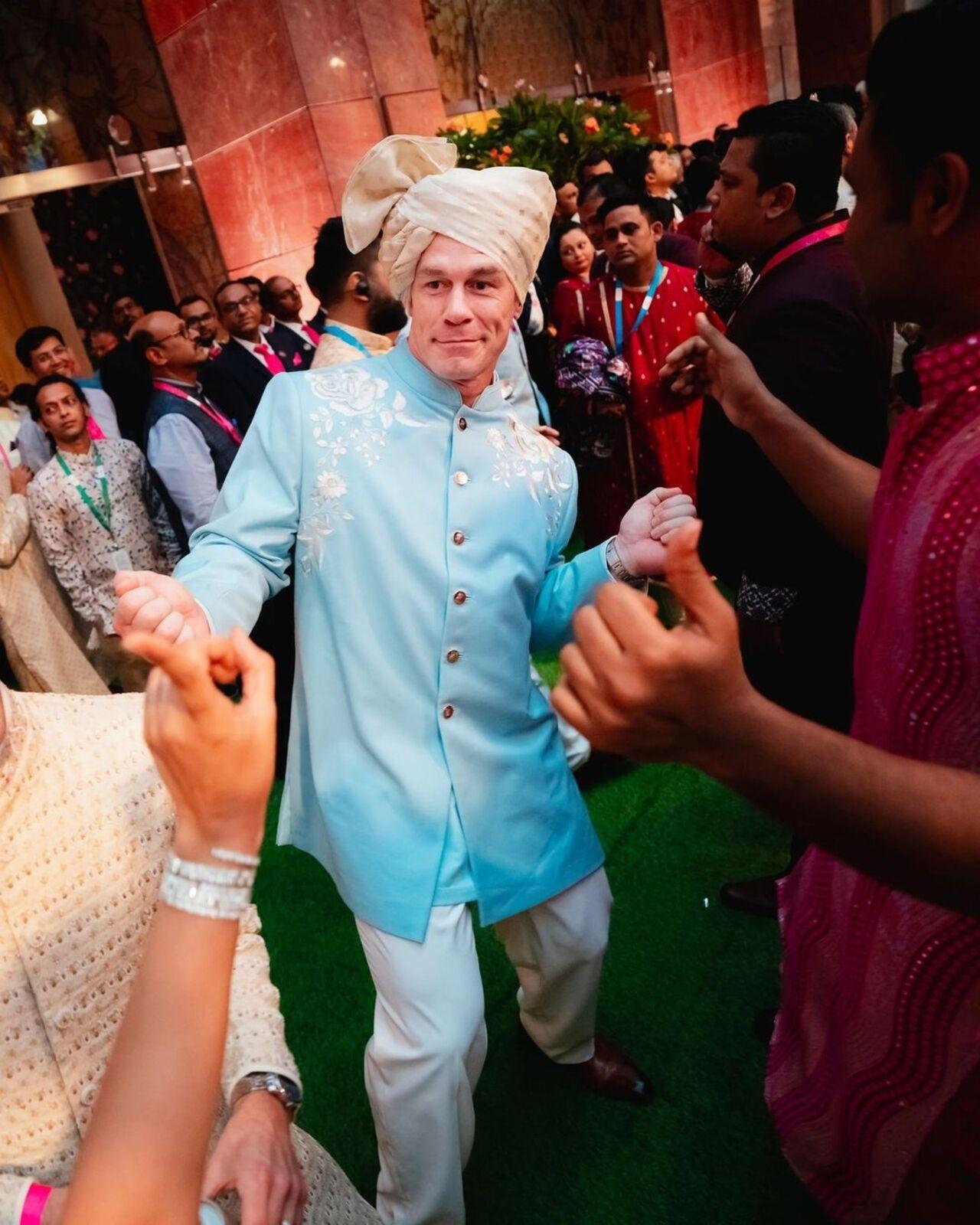 The extravagant wedding celebration witnessed an unexpected highlight as WWE legend John Cena brought his signature charisma to the dance floor, delighting guests with his iconic moves. 