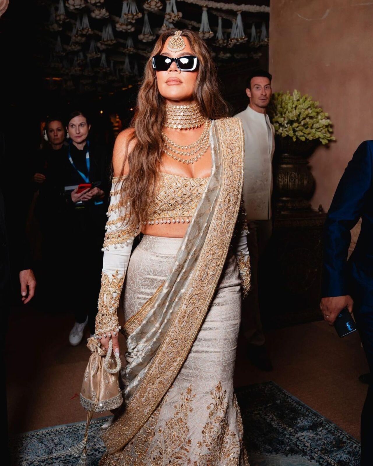 Khloe Kardashian also joined the extravaganza in a gorgeous white and golden saree by Manish Malhotra. She glammed up the look even more with a pair of sunglasses. 