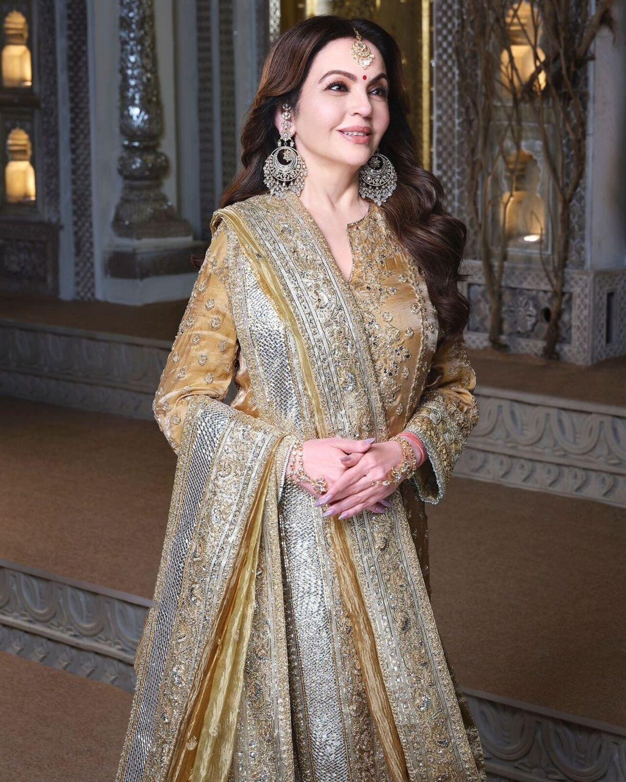 Nita Ambani stunned in an antique gold ensemble by Manish Malhotra. 
