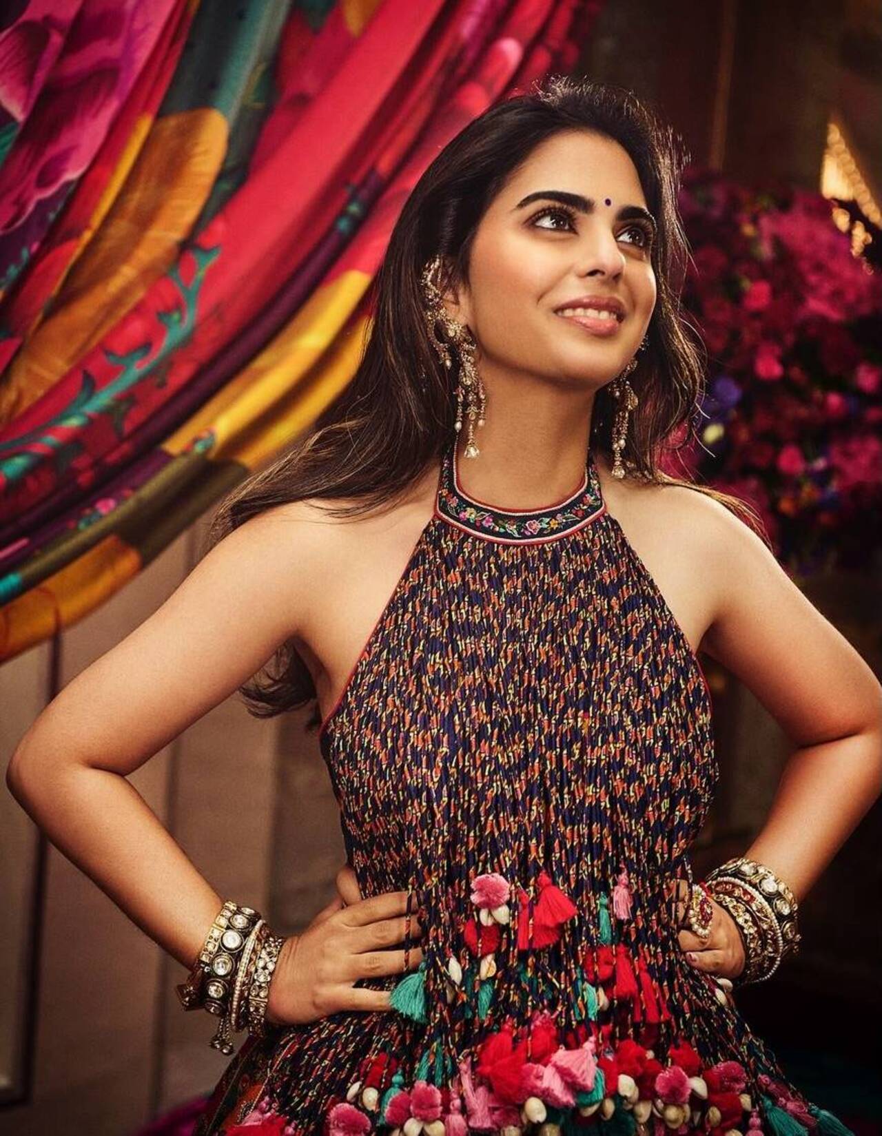 Isha let her hair down and flaunted those voluminous locks by completing her look with minimal makeup and a bindi. 