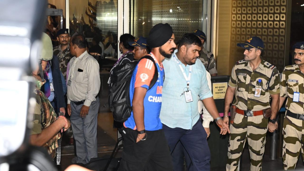Arshdeep Singh being escorted out of the airport as fans await the sight of their favourite heroes and sight of the silverware