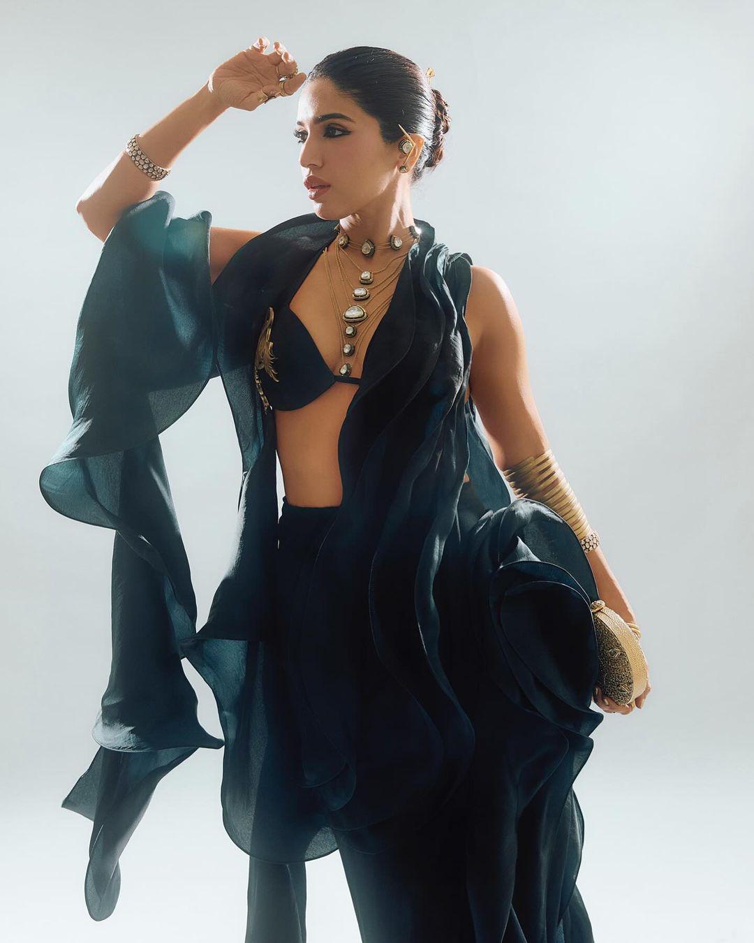 On Day 3 of the Ambani wedding celebrations, actor Bhumi Pednekar chose a more modern look, wearing a custom black sari with three pallus designed by Gaurav Gupta.