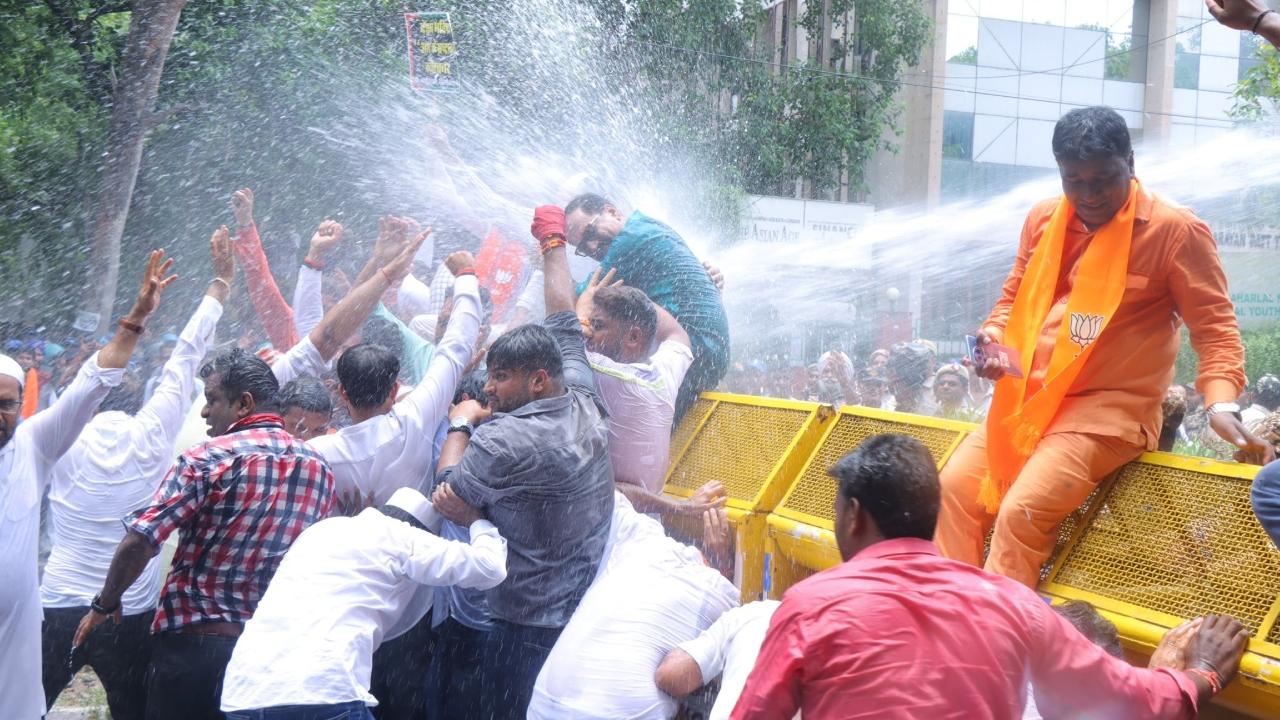 Water cannons were used by Delhi Police to disperse protesters, who were trying to reach the AAP Headquarters
