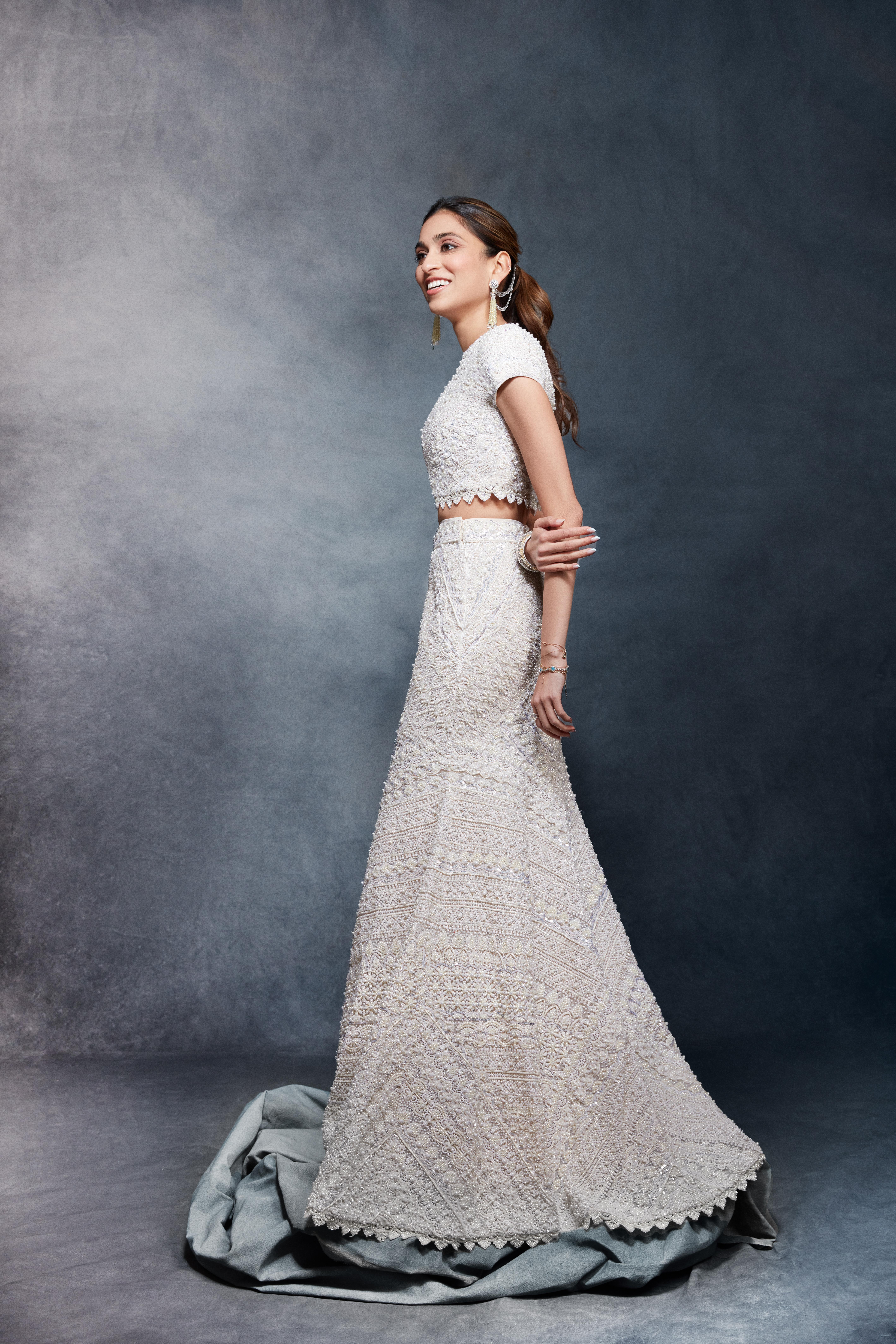 Diya Mehta who styled Shloka Ambani this whole wedding season, stunned in an ivory lehenga by Abu Jani Sandeep Khosla