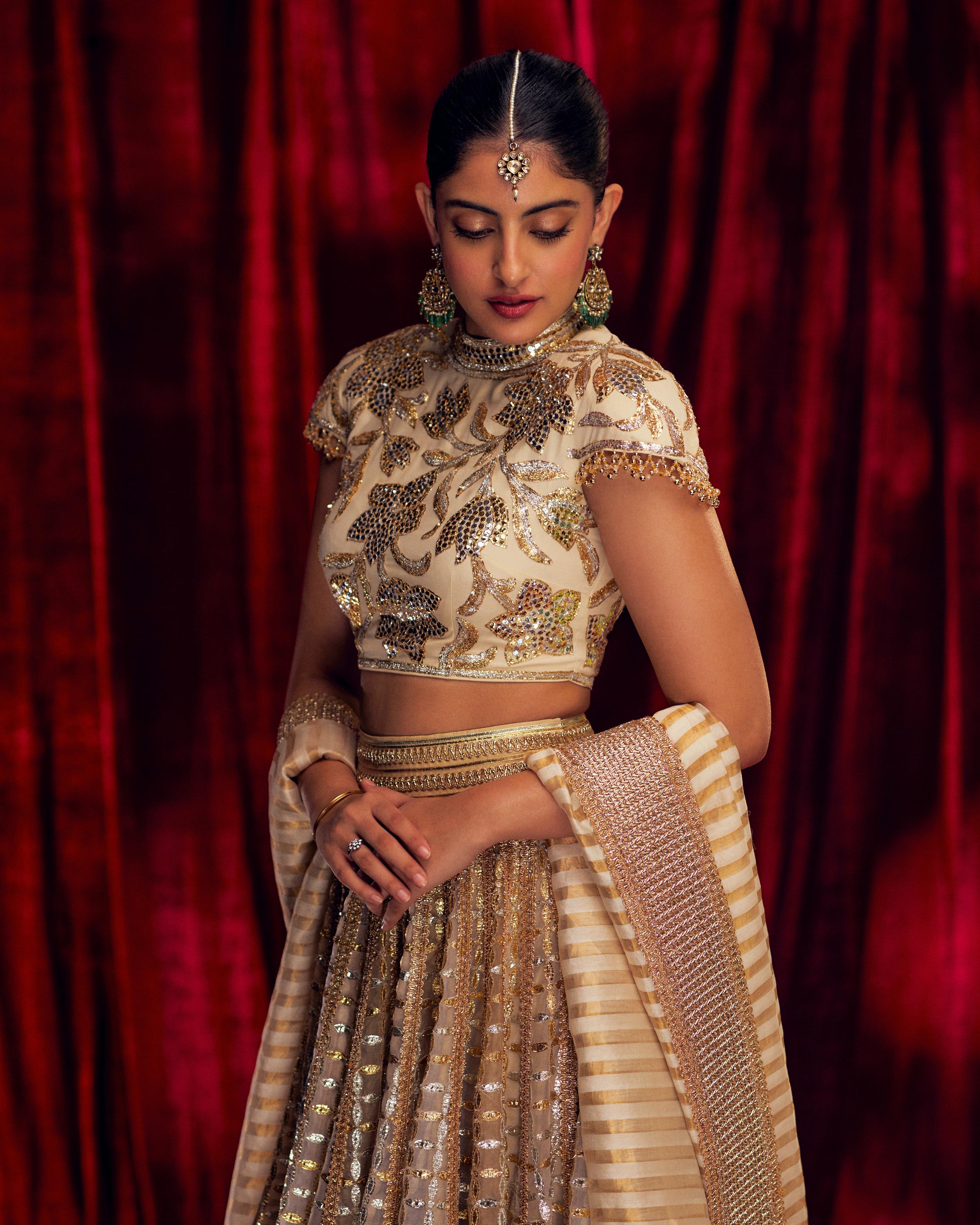 Navya also wore a 48-panel Gota jaali Ghagra in ivory and beige. The Zardozi Surti border added intricate detail to each fold, making the outfit even more stunning.