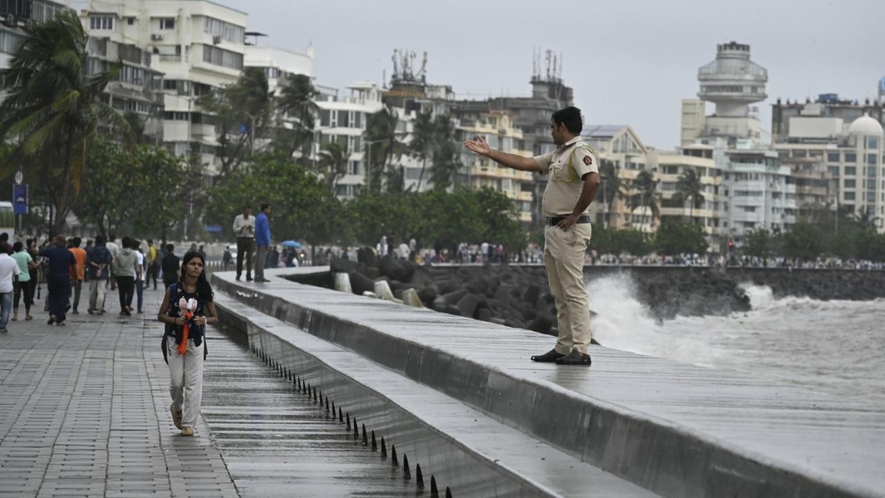 Police officials were seen patrolling at Marine Drive on Monday. Pics/Ashish Raje