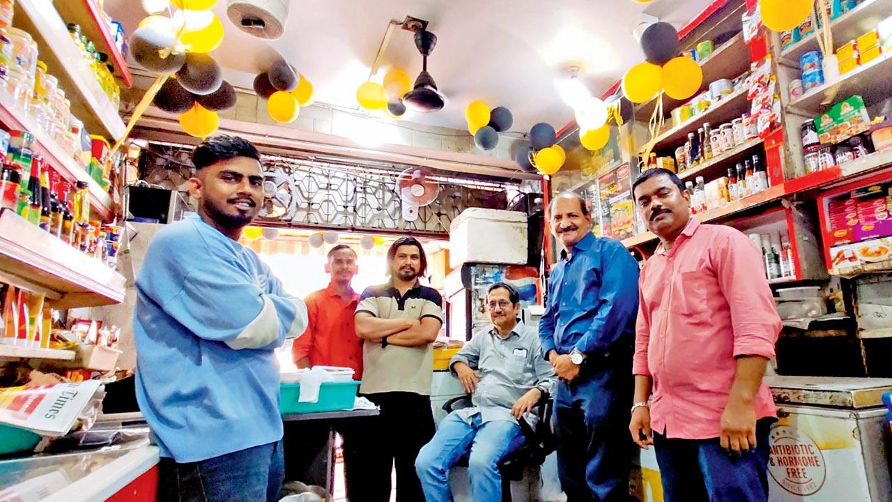 Brothers Pravin (seated) and Parag (second from left) with their some of their dedicated staff. Pics/Fiona Fernandez