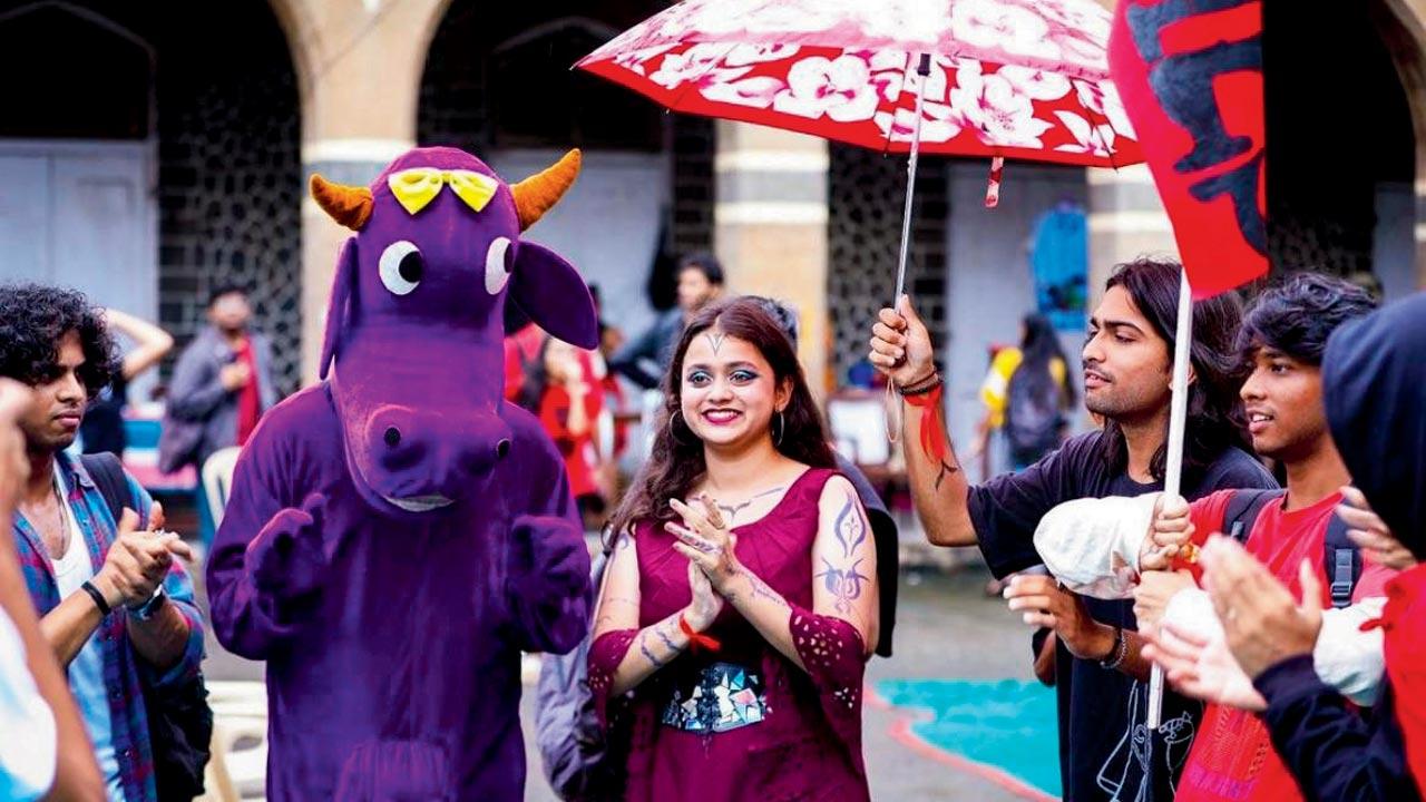 Fest mascot, Polly the purple cow, engages with the participants