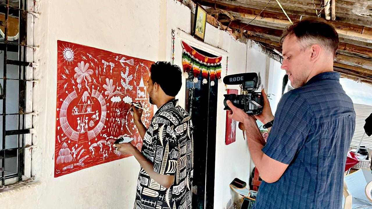 Boas Schwarz documents top a Warli artist