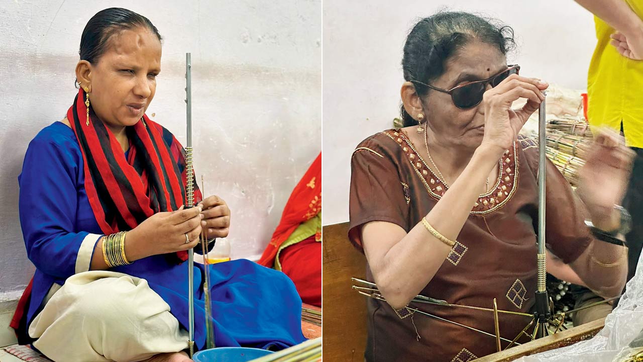 Two visually-impaired women prepare the frame for the umbrellas at the NGO