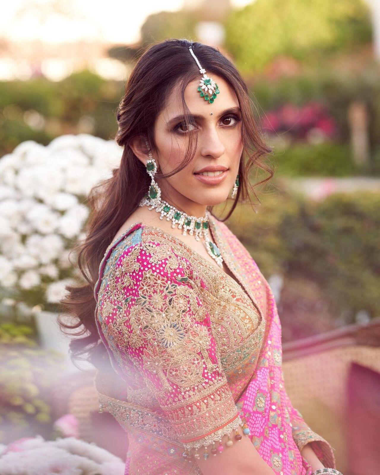 For the pre-wedding in Jamnagar, Shloka Ambani paired her Rimple and Harpreet ensemble with a dainty emerald choker set. 