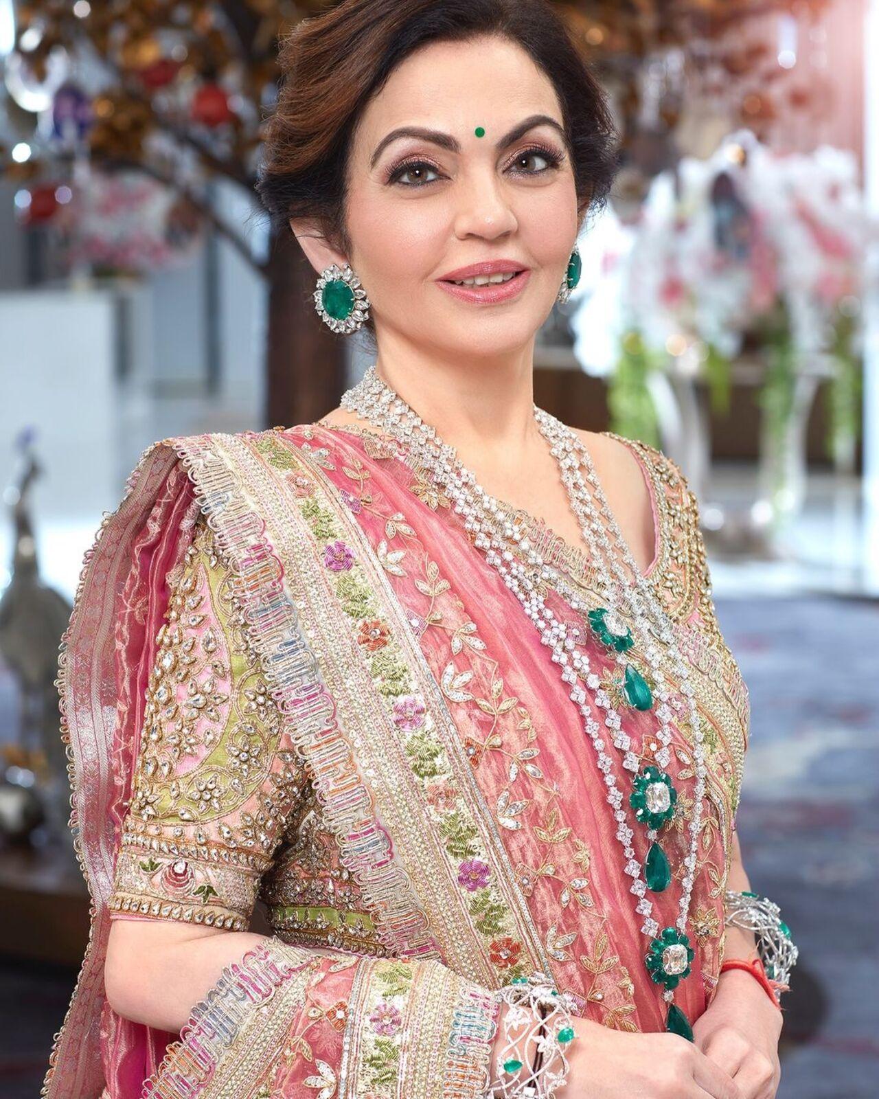 Nita Ambani graced the event in a three-piece emerald and diamond necklace with giant studs, bangles, and a ring. 