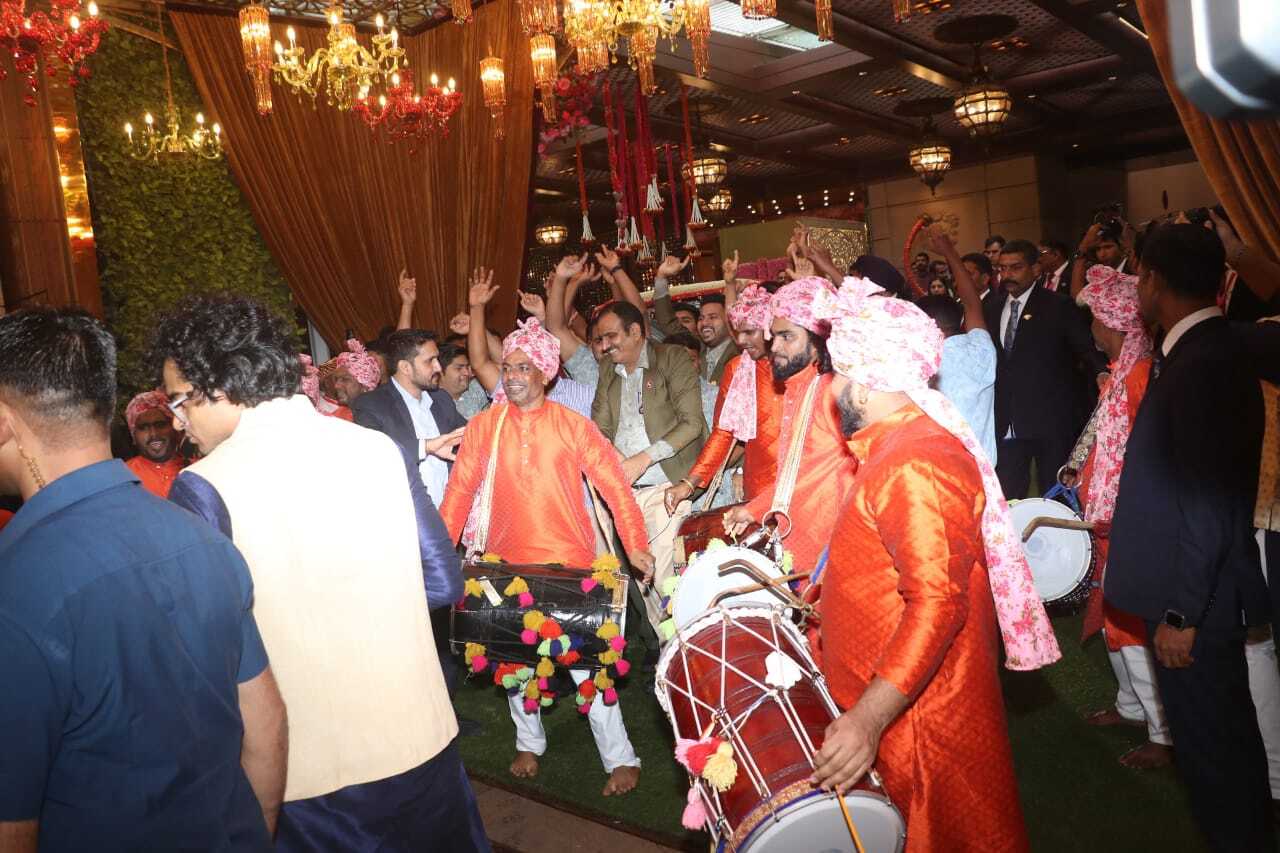 Dhol players entertain guests at Antilla as Anant gets ready to leave from his home for the wedding venue