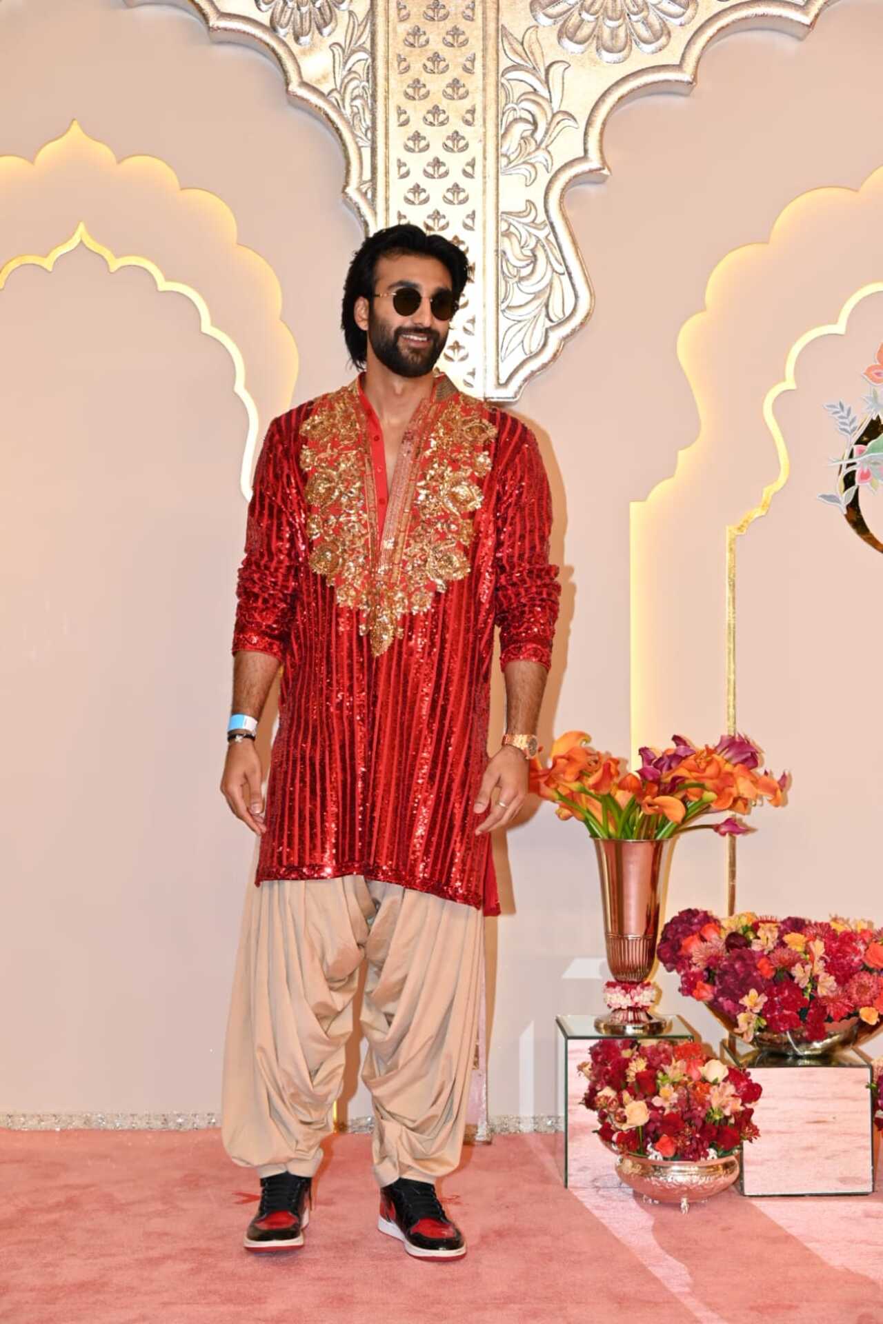 Meezaan Jaffrey wore a shimmery red kurta with the letters 'DDC' written in the back