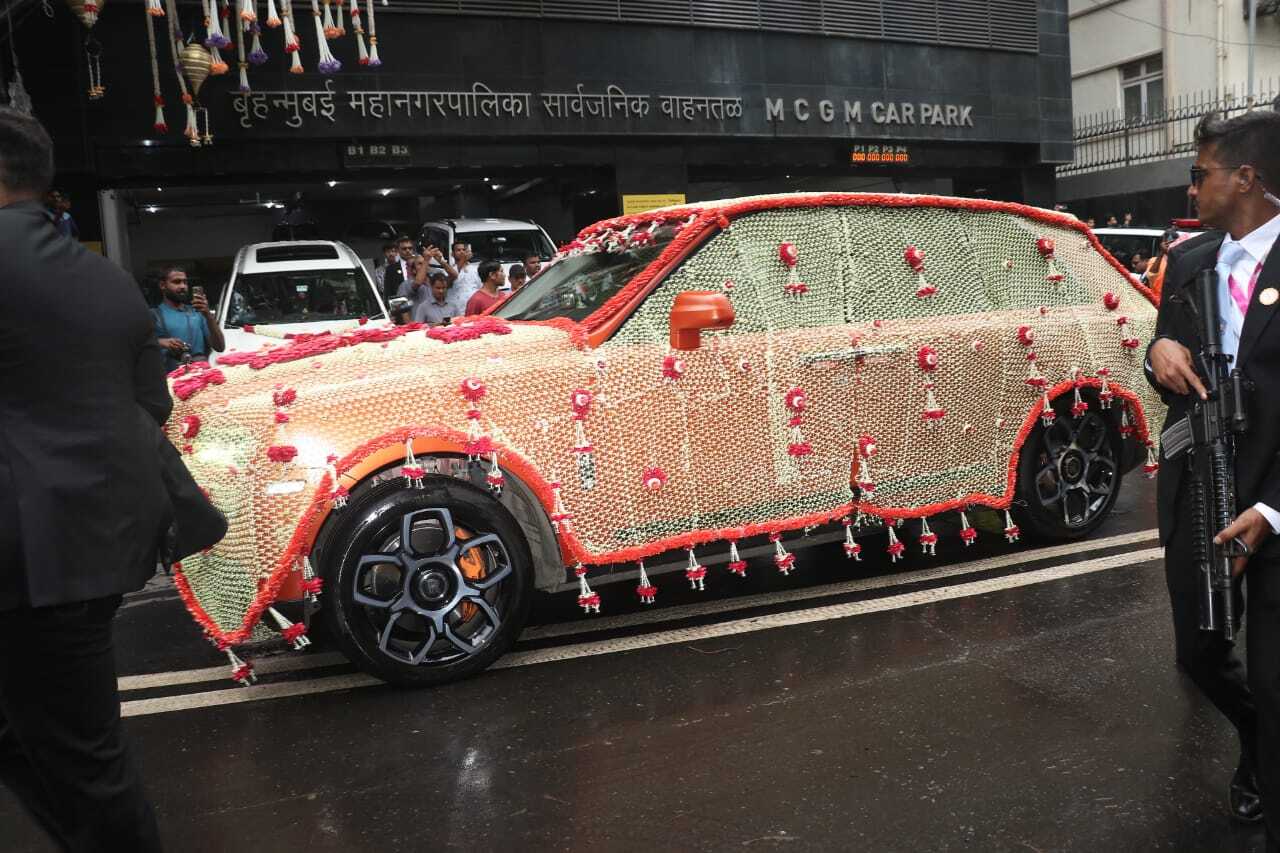 Dulhe raja sets out from his home, Antilla, in a luxury car decorated with flowers