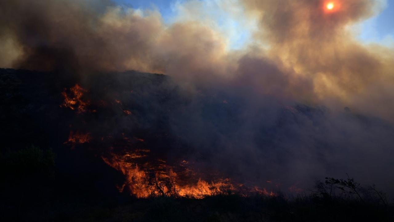 Smoke rises during a wildfire in Keratea, near Athens, Greece