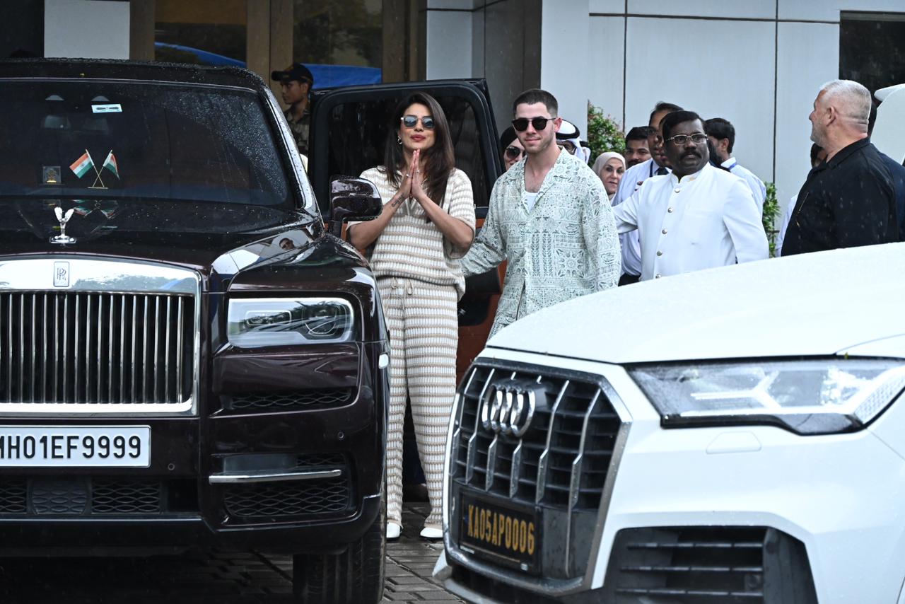 Priyanka Chopra and Nick Jonas waited and posed for the paparazzi as they left for their hotel