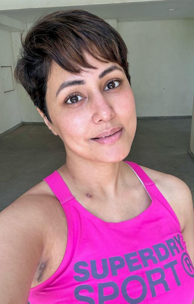 On Saturday morning, Hina shared selfies proudly owning her treatment scars: 'What do you see in this picture? The scars on my body or the hope in my eyes?
