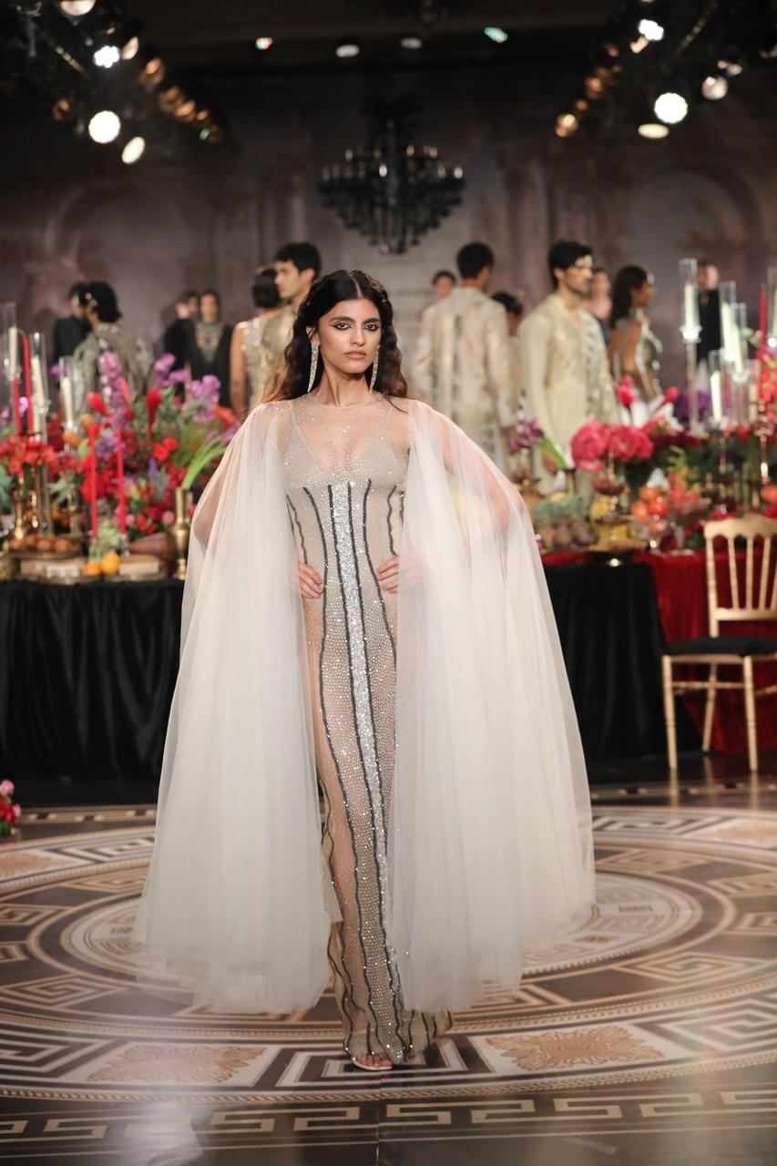 The collection features jewel tones such as ruby, emerald, royal blue, and black, accented with gold and gunmetal embellishments and embroidery.